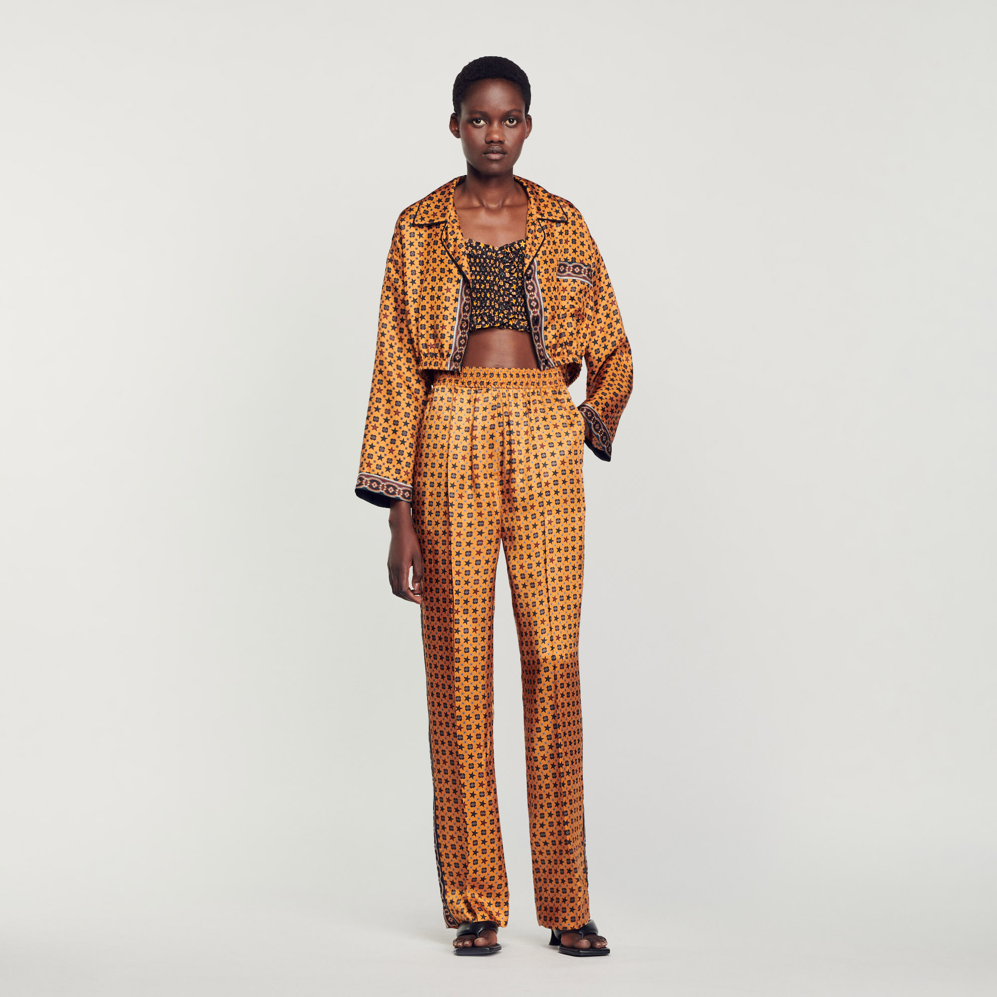 Sandro viscose Pocket lining: Flowing, loose-fit pants smocked at the waist, embellished with a scarf print and contrasting stripe on the side