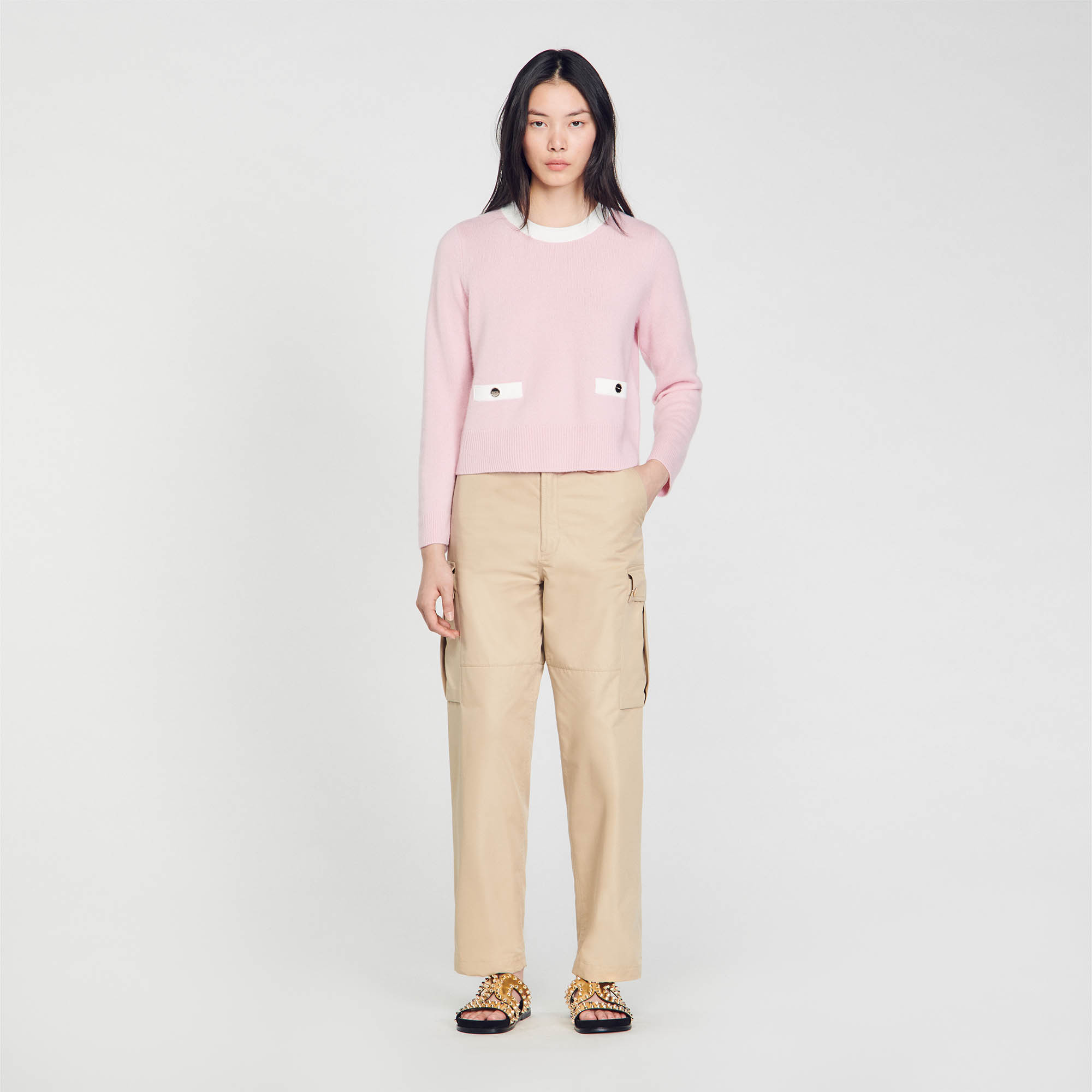 Sandro wool Fine knit sweater with a round neckline, contrasting pockets, and a contrasting button placket on the back