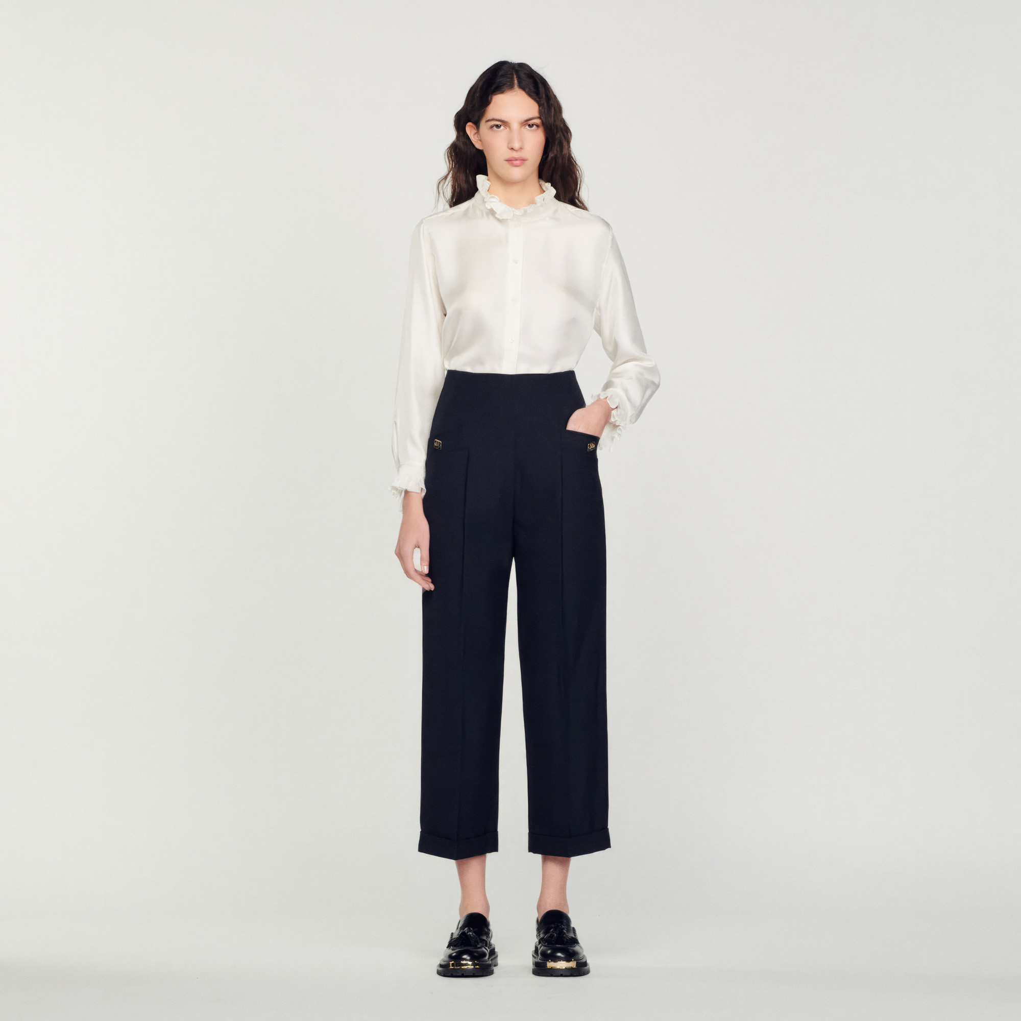 Sandro polyester Sandro women's pants â€¢ Virgin wool pants â€¢ High waist â€¢ Side pockets with fancy double S buttons â€¢ Piped pockets at the back â€¢ Turn-ups at the hems â€¢ Concealed zip fastening at the center back â€¢ These pants match the jacket The model is 5'10 tall and wears a size 36 FR / 4 US