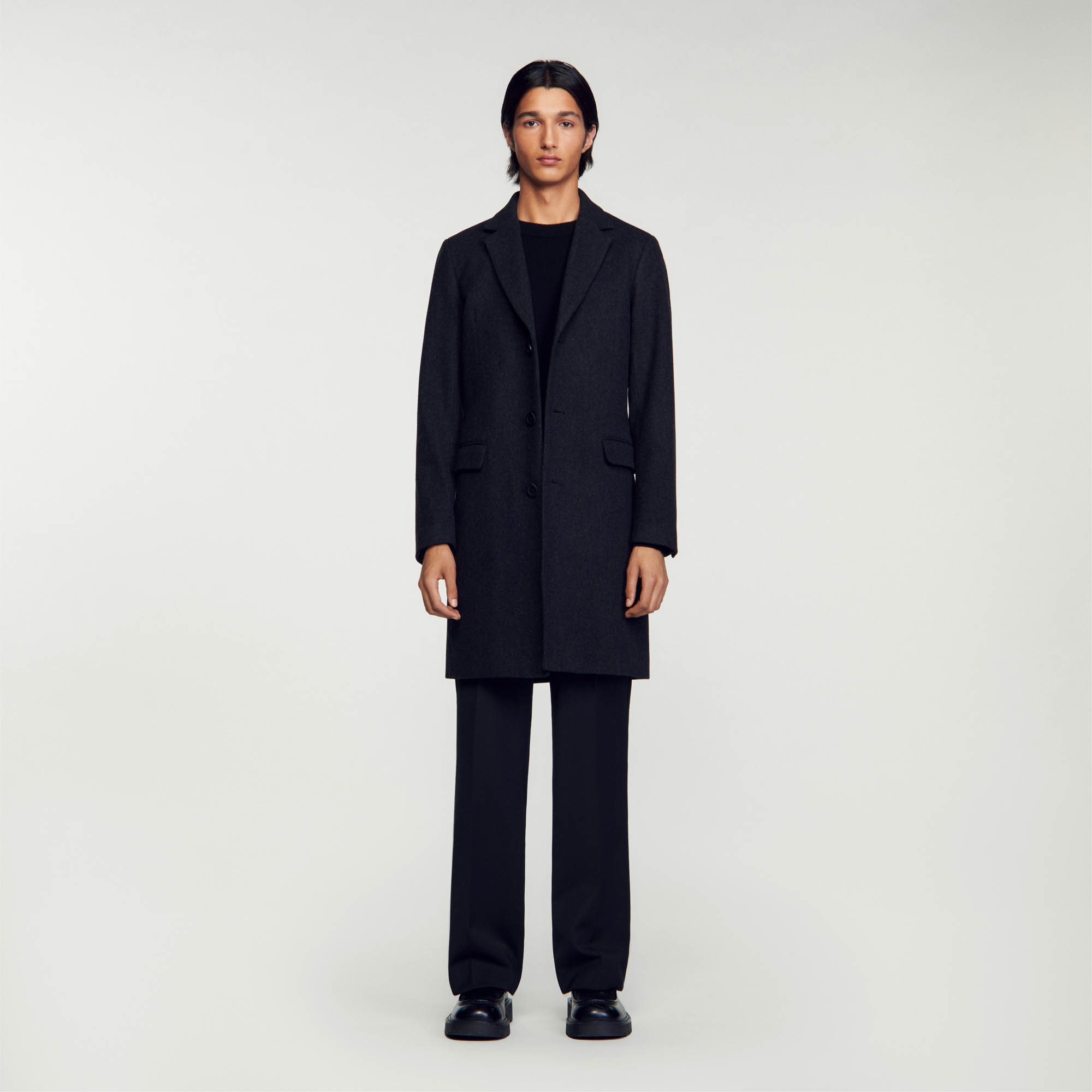 Sandro wool Broadcloth wool coat featuring a lapel collar, long sleeves, three-button fastening, side pockets and a vent at the back