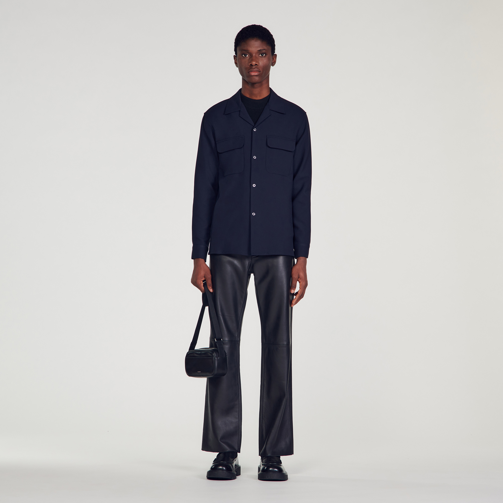 Sandro polyester Oversized shirt featuring a shark collar and long sleeves with buttoned cuffs, a button fastening and two patch pockets on the chest