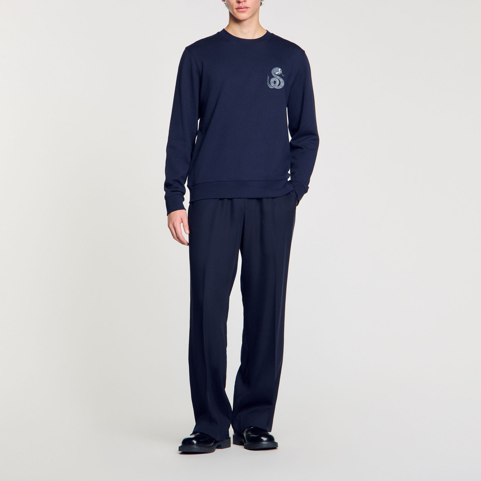 Sandro cotton Milano knit jacket with mock neck, long sleeves and embossed floral snake patch