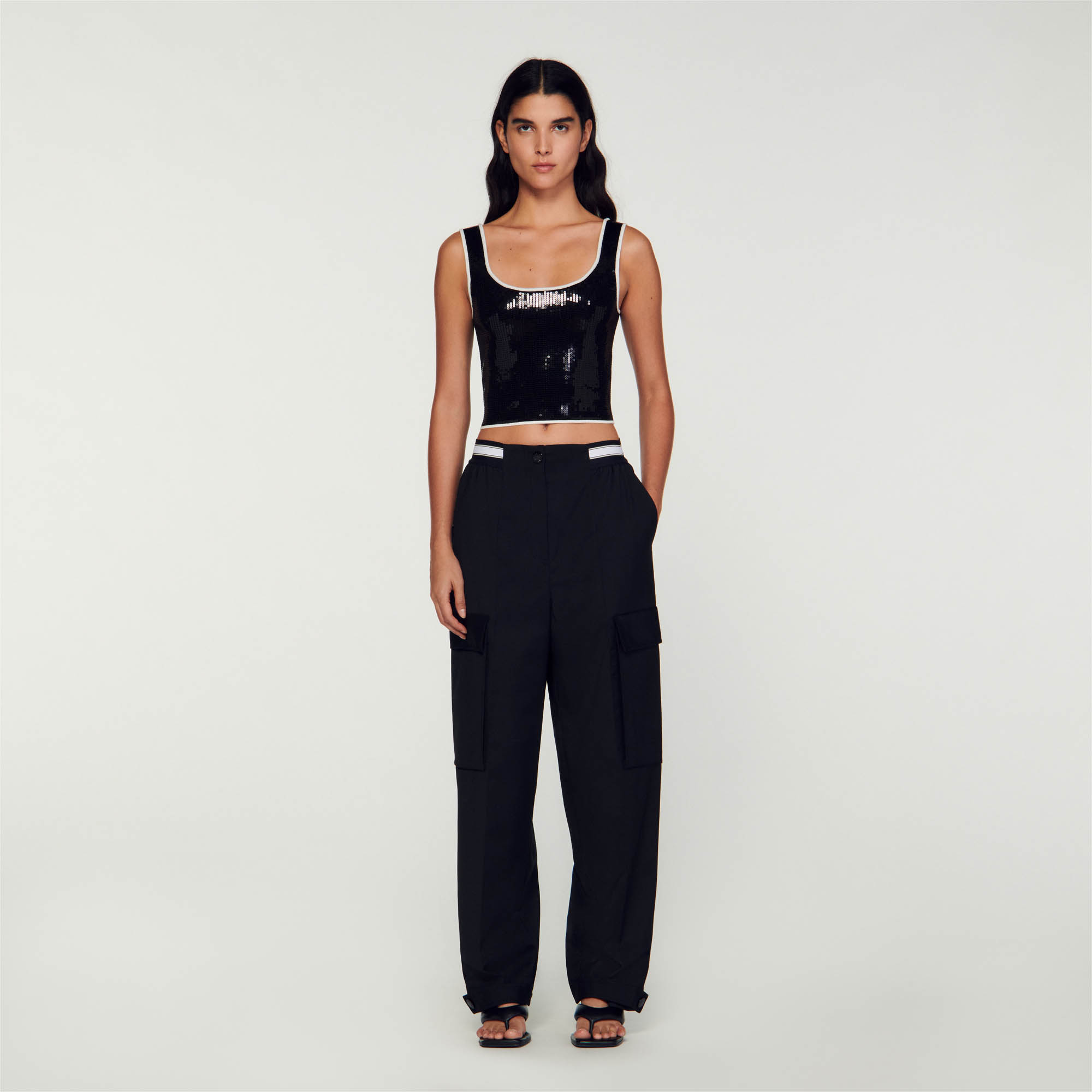 Sandro viscose Cropped knit sleeveless bralette-style top with all-over sequin embellishment, a round neckline, and contrasting trim around the edges