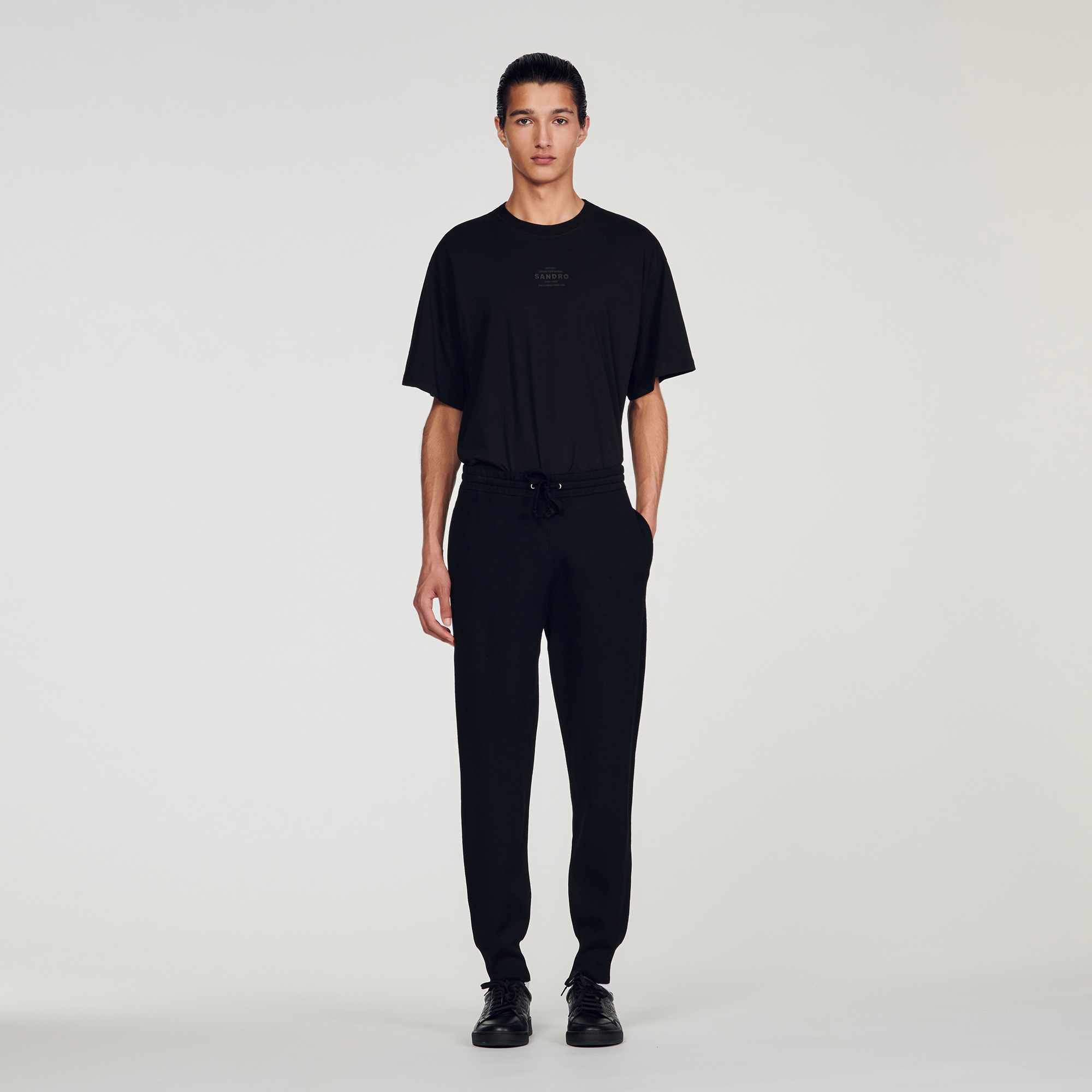 Sandro viscose Sandro men's jogging bottoms â€¢ Knit jogging bottoms â€¢ Smocked waistband with drawstring â€¢ Pockets at the sides â€¢ Ribbed trim finish Model is wearing a size S The viscose in this item has a lower environmental impact than traditional viscose