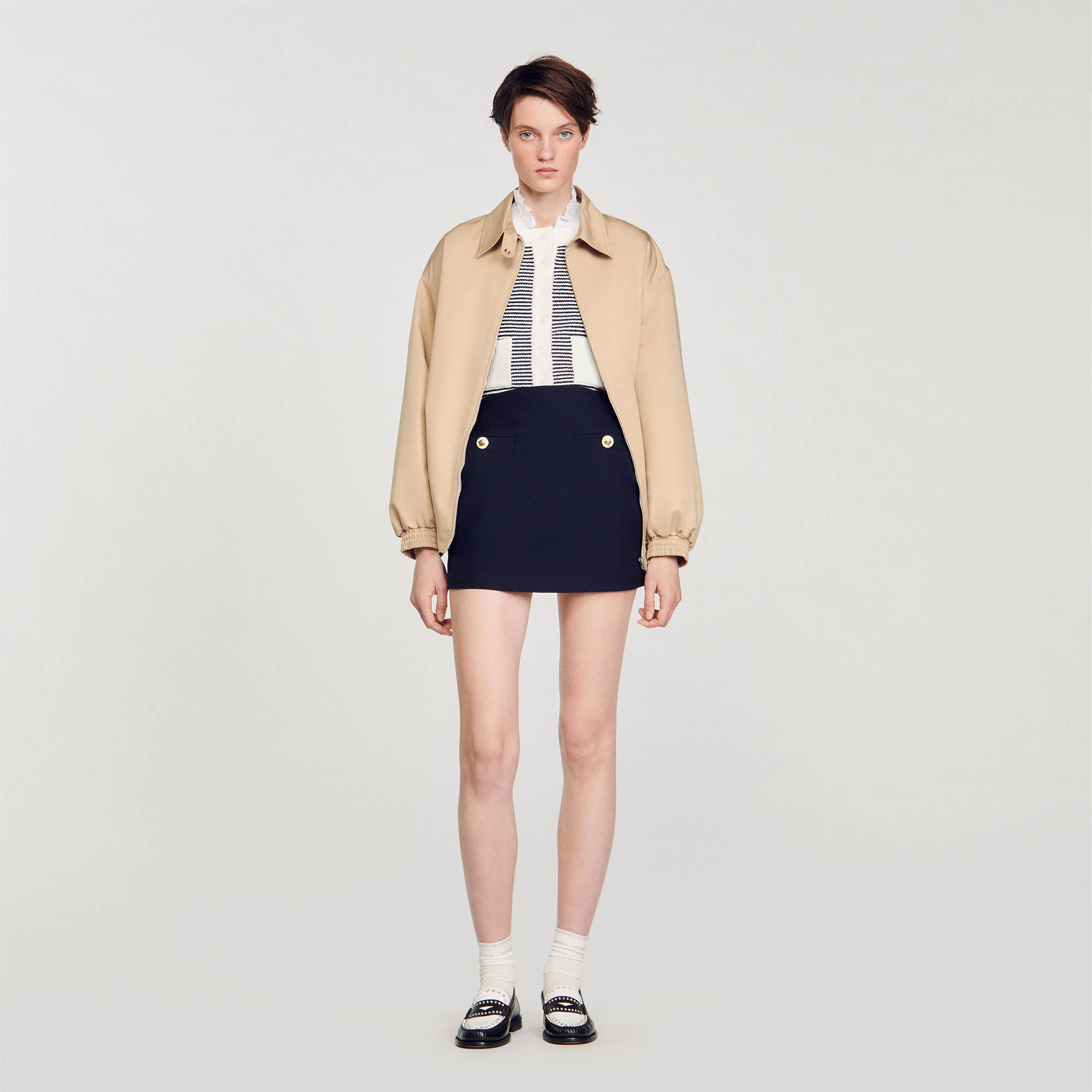 Sandro virgin wool Short skirt in wool-blend twill, with small side slits and welted mock pockets on the front embellished with decorative buttons