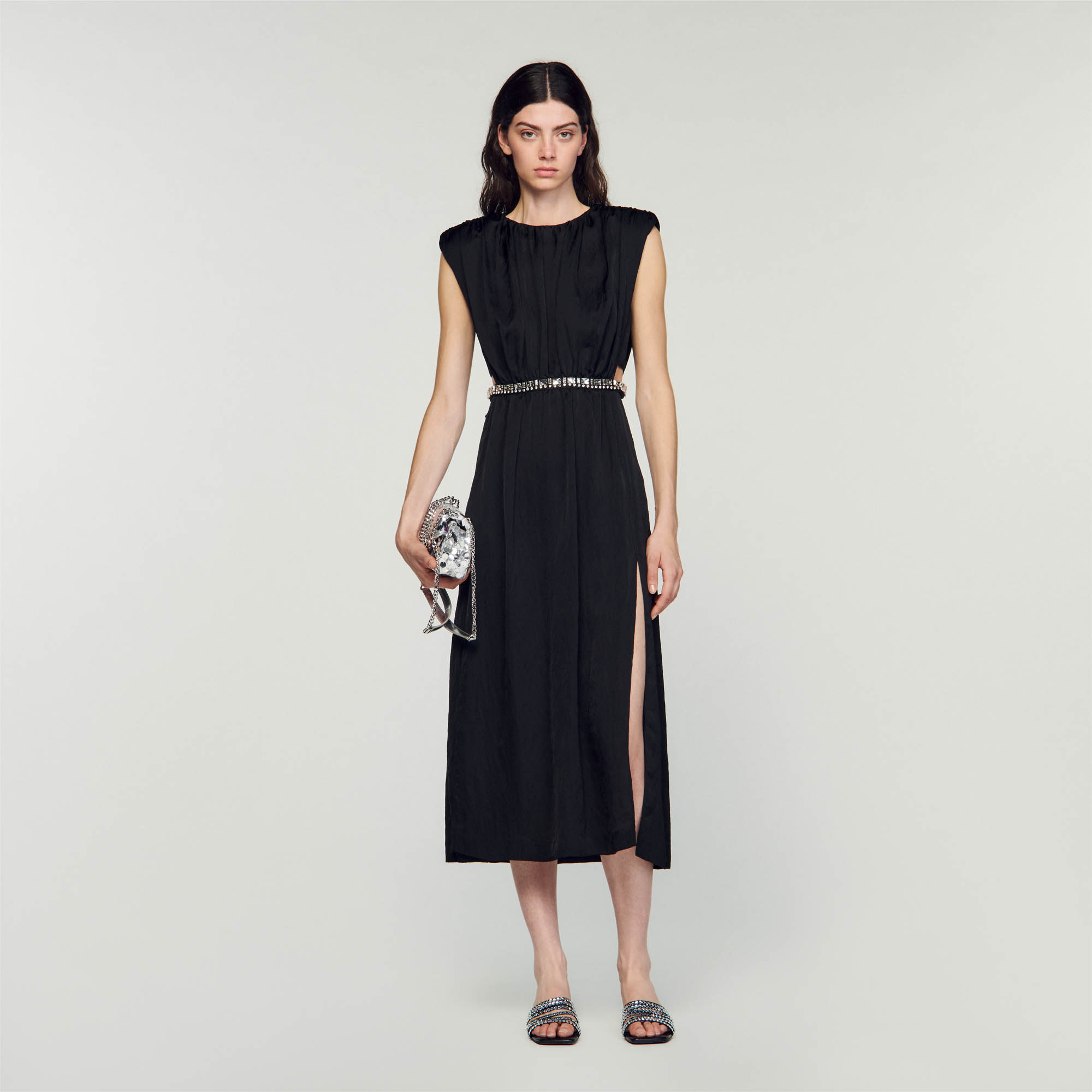 Sandro acetate Sleeveless maxi dress in crinkle-effect fabric featuring a round neck, structured shoulders, a cutaway on the waist embellished with a jewelry-style trim and a slit at the side