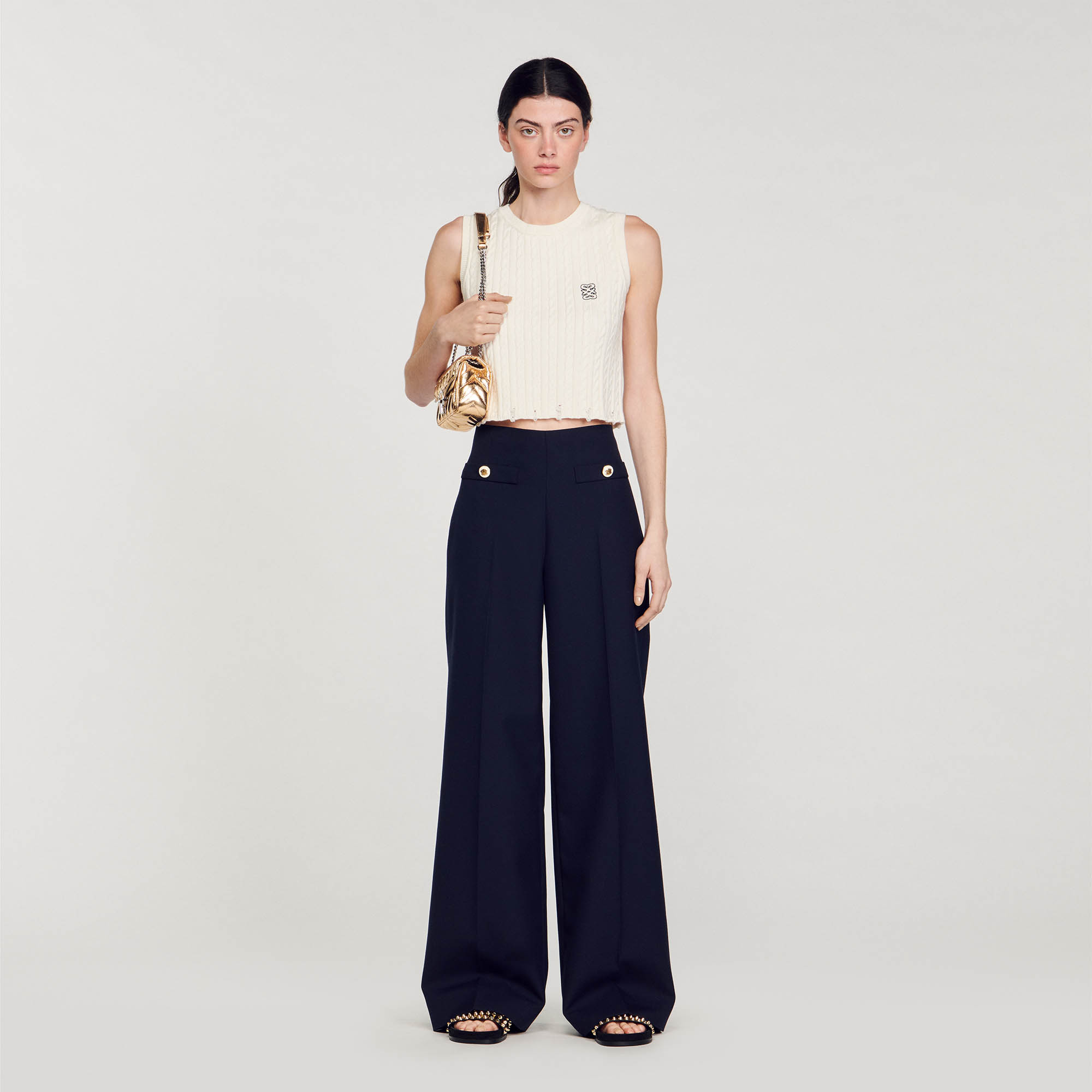 Sandro virgin wool High-waisted, wool-blend twill trousers with flared legs, large welt pockets with decorative button fastenings and ironed creases down the leg