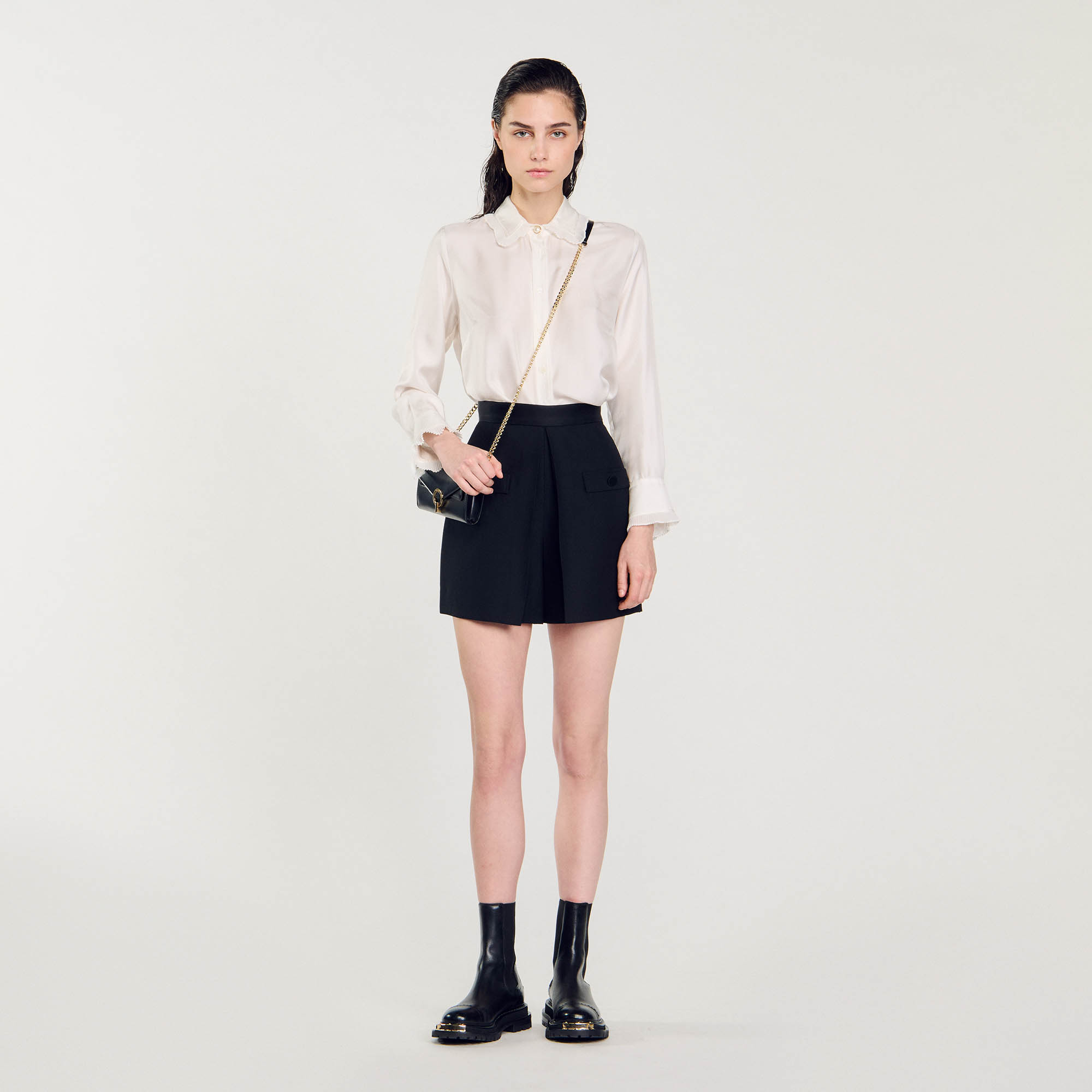 Sandro polyester Sandro women's shorts â€¢ Wool shorts â€¢ High-waisted with satin inserts â€¢ Trompe l'oeil pockets with covered buttons â€¢ Pleats front and back â€¢ Concealed zip fastening at the side â€¢ These shorts match the jacket