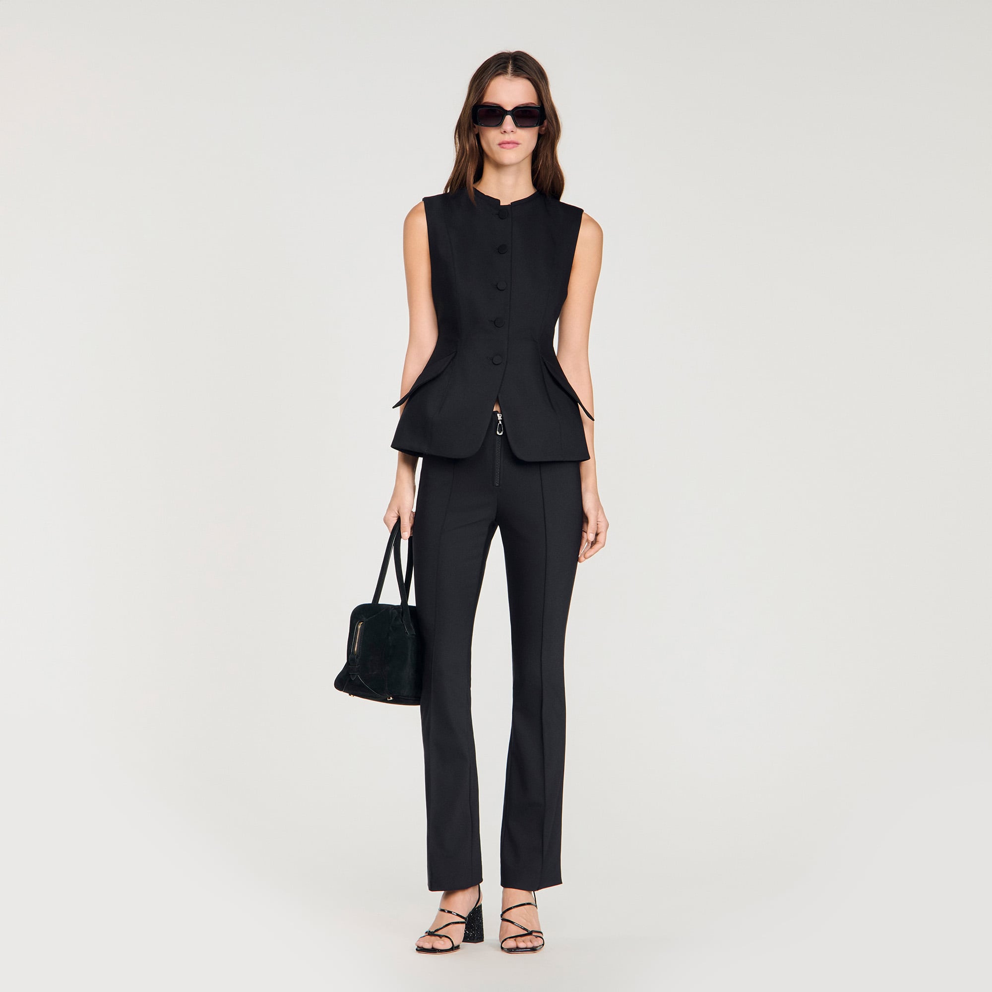 Sandro cotton Fitted sleeveless vest with a flared peplum, featuring a standing collar, covered buttons on the front and flap pockets