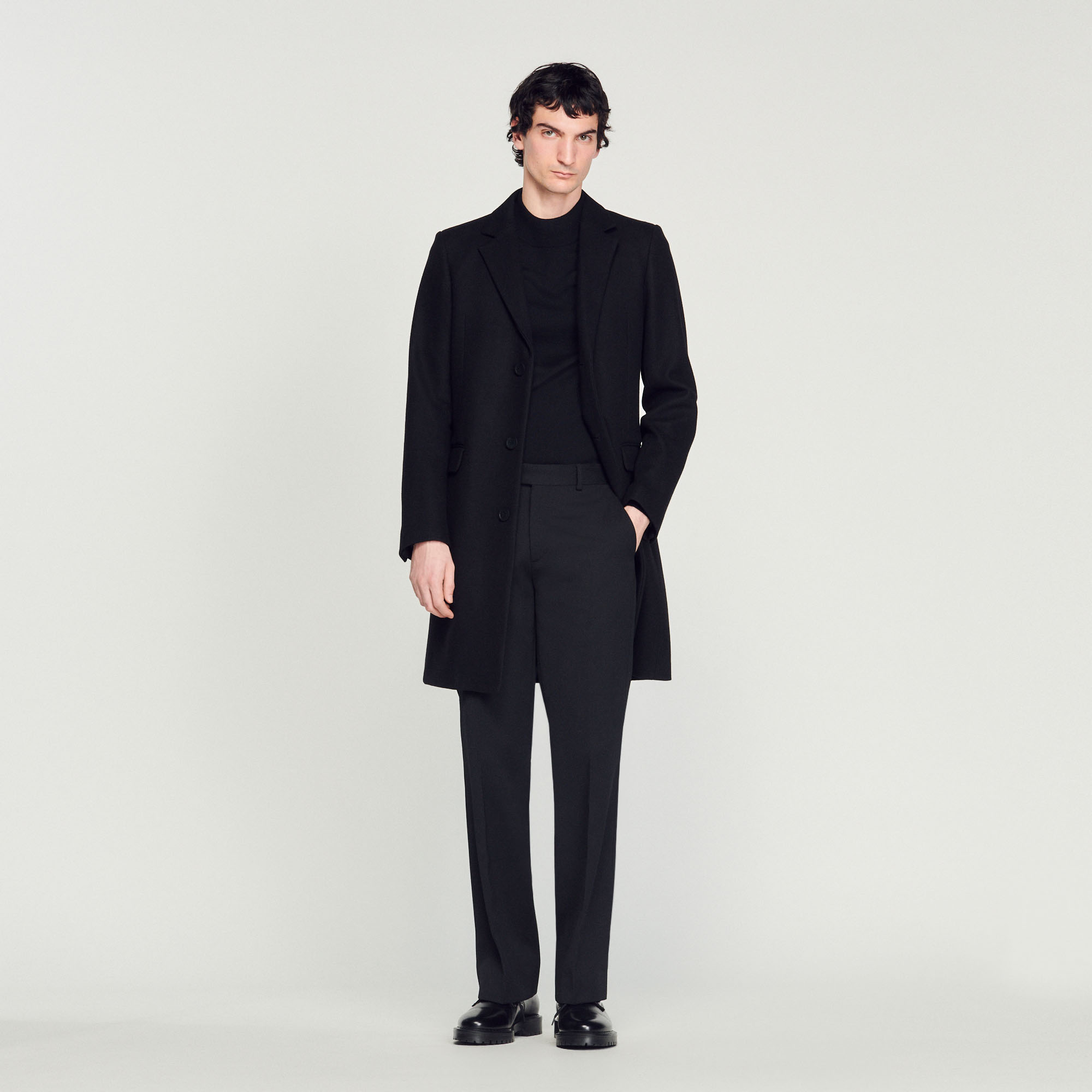 Sandro wool Sandro men's coat â€¢ Wool coat â€¢ Tailored collar â€¢ Fastened with three buttons â€¢ Side pockets with flap â€¢ Internal pockets â€¢ Vent at the back â€¢ Fitted cut Model is wearing a size S and is 6'1''