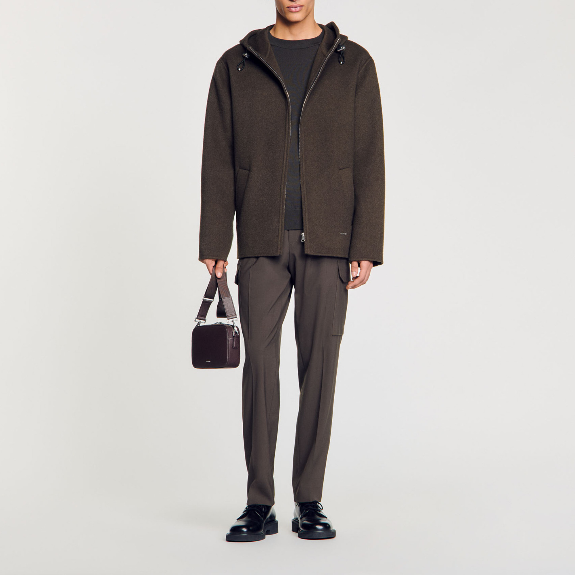 Sandro wool Waterproof hooded windbreaker with long sleeves, a zip fastening, two pockets and drawstrings with stoppers