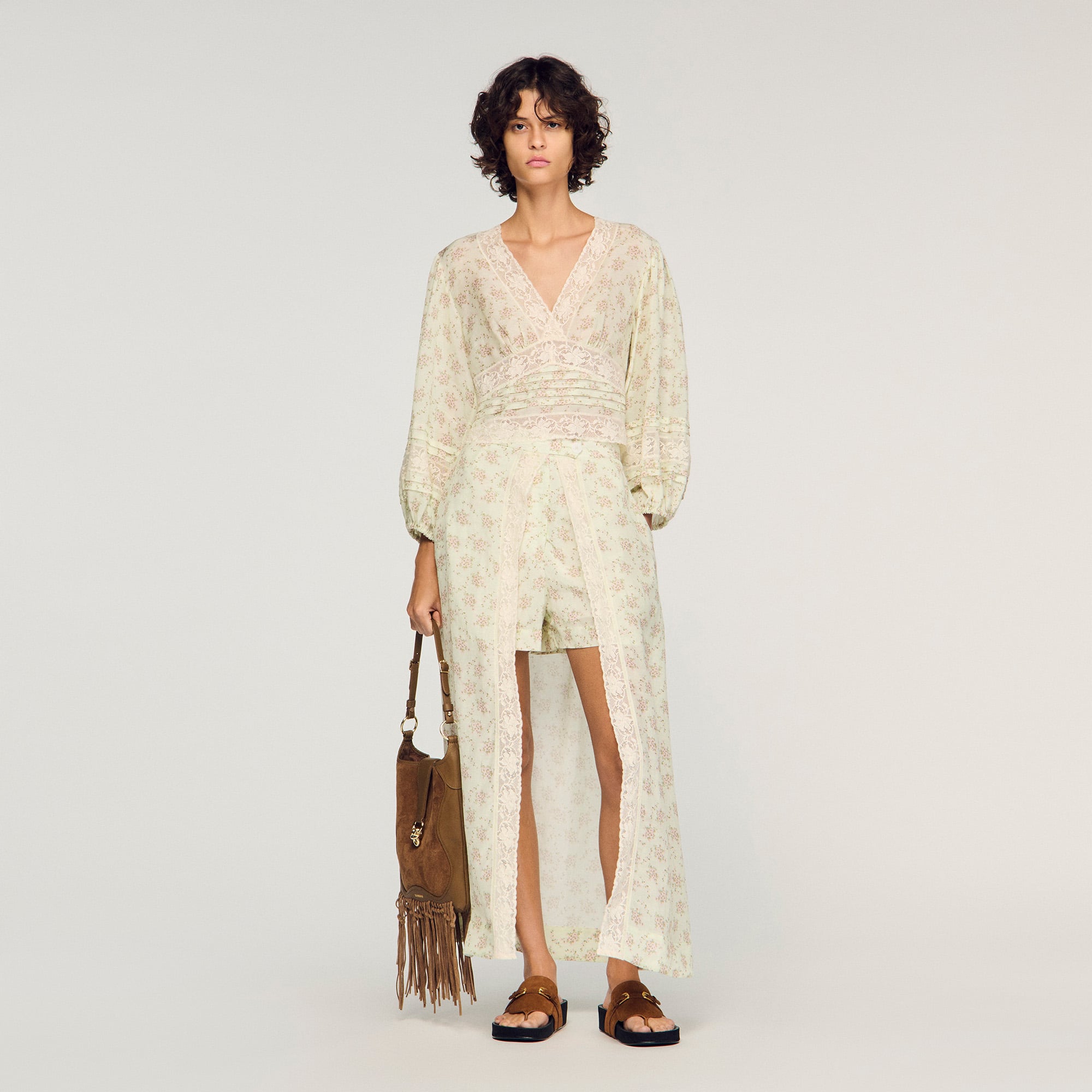 Sandro viscose Floral print crop top featuring a V-neck, long full sleeves with elasticated cuffs, lace trim and a large slit at the back with a tie fastening
