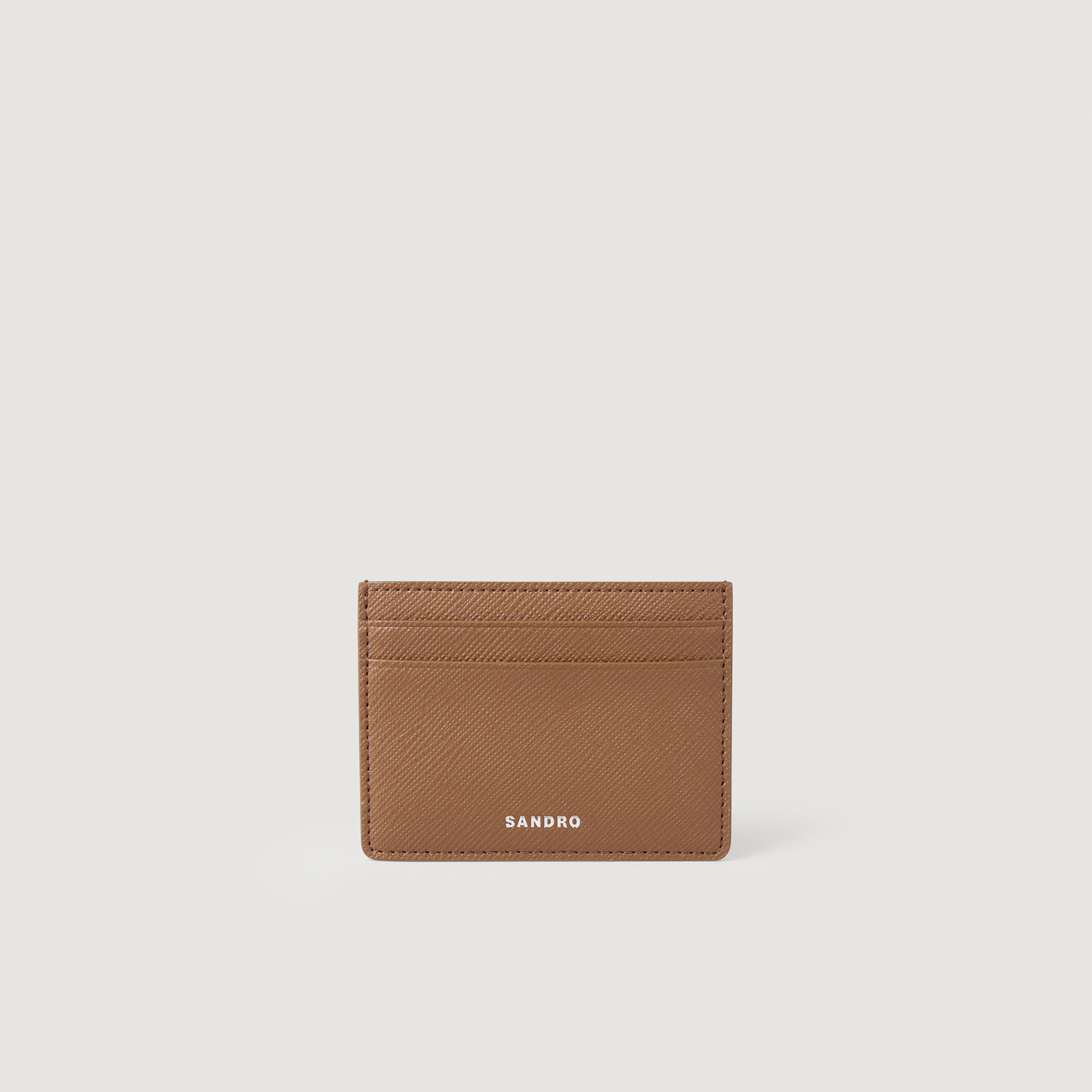Sandro synderm Coating: Sandro men's leather card holder â€¢ Saffiano leather card holder â€¢ Four slots â€¢ One compartment â€¢ Embossed Sandro logo â€¢ Dimensions: 4 x 3 in By purchasing this product, you are supporting more responsible leather manufacturing via the Leather Working Group, which certifies tanneries based on their environmental performance (water, energy, waste, etc