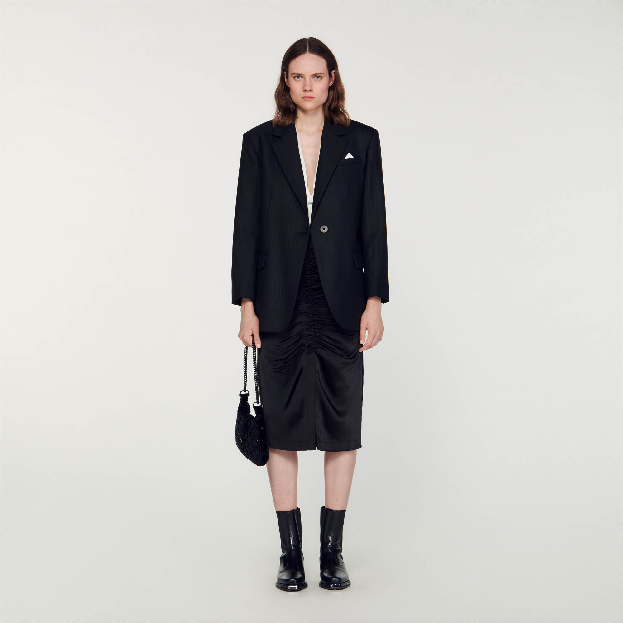 Sandro polyester Oversized blazer embellished with thin stripes, featuring long sleeves, a suit collar, flap pockets on the sides and a welt pocket on the chest