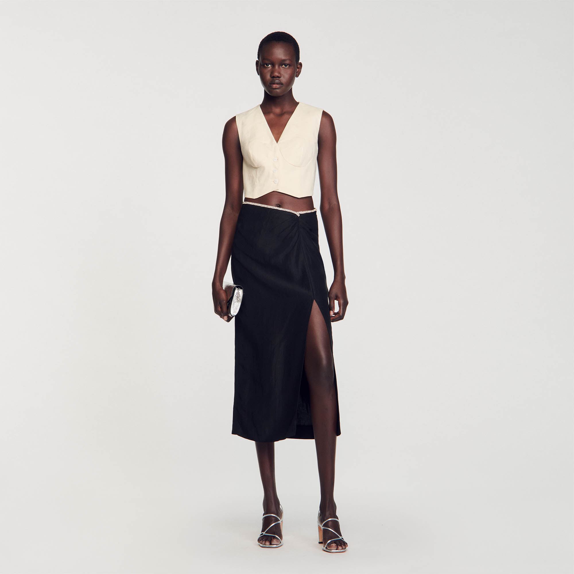 Sandro viscose Midi pencil skirt with a front slit and a gathered asymmetrical waist embellished with a multicolored crystal trim