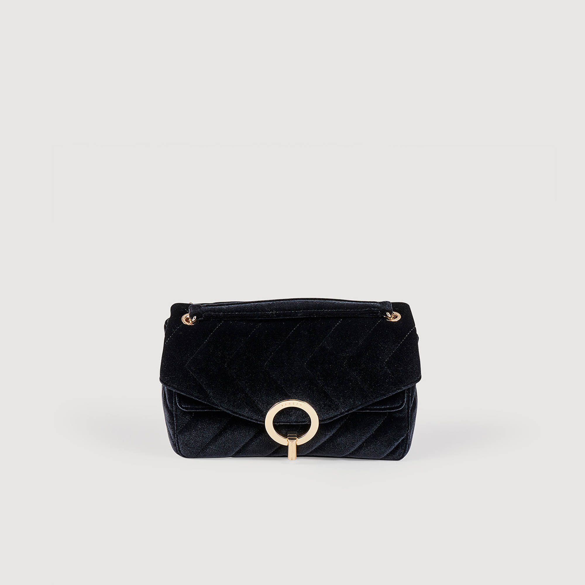 Sandro polyester Lining: Sandro women's bag â€¢ Quilted velvet bag to carry in two ways â€¢ Signature graphic fastening â€¢ Split leather lining â€¢ Inside patch pocket â€¢ Double compartment â€¢ Patch pocket on the back â€¢ Chain strap with leather shoulder tab â€¢ L 23 cm x H 18 cm x D 7 cm