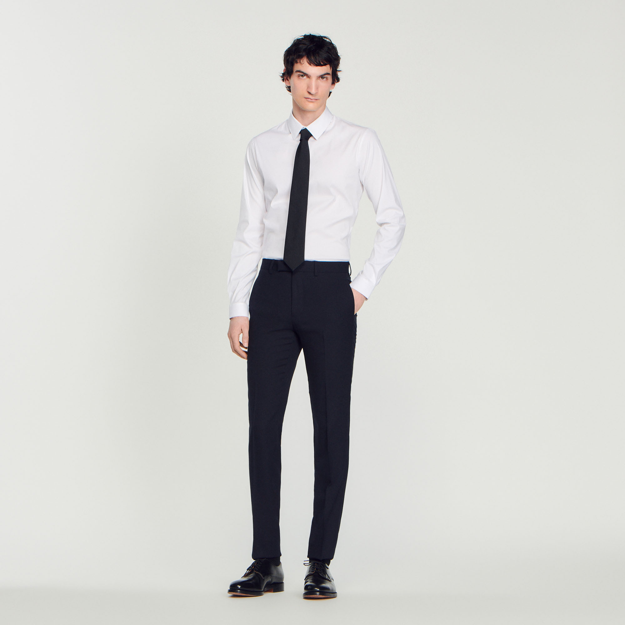 Sandro wool Sandro men's pants â€¢ Wool suit pants â€¢ Waistband with belt loops â€¢ Pockets at the sides â€¢ Piped pockets at the back â€¢ These pants match the jacket Model is wearing a size 38 and is 6'1'' Occasionally, a few alterations may be necessary to make the suit fit perfectly