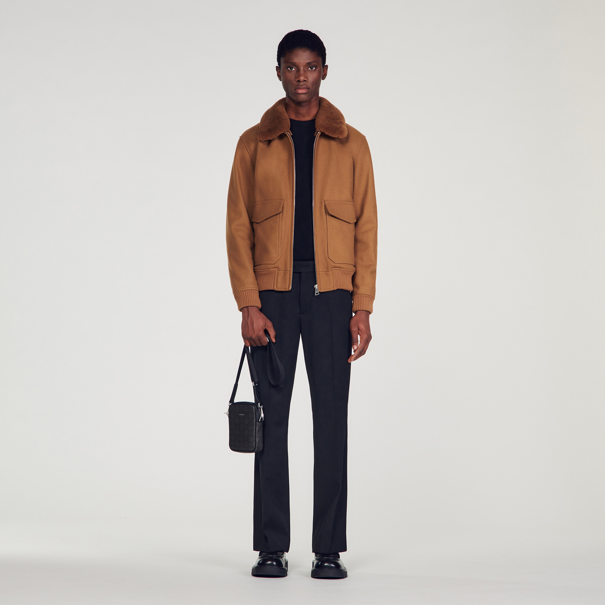 Sandro wool Sandro men's jacket â€¢ Aviator jacket â€¢ Detachable sheepskin collar â€¢ Two flap pockets â€¢ Ribbed edging on the cuffs and back Model is wearing a size S and is 6'2''