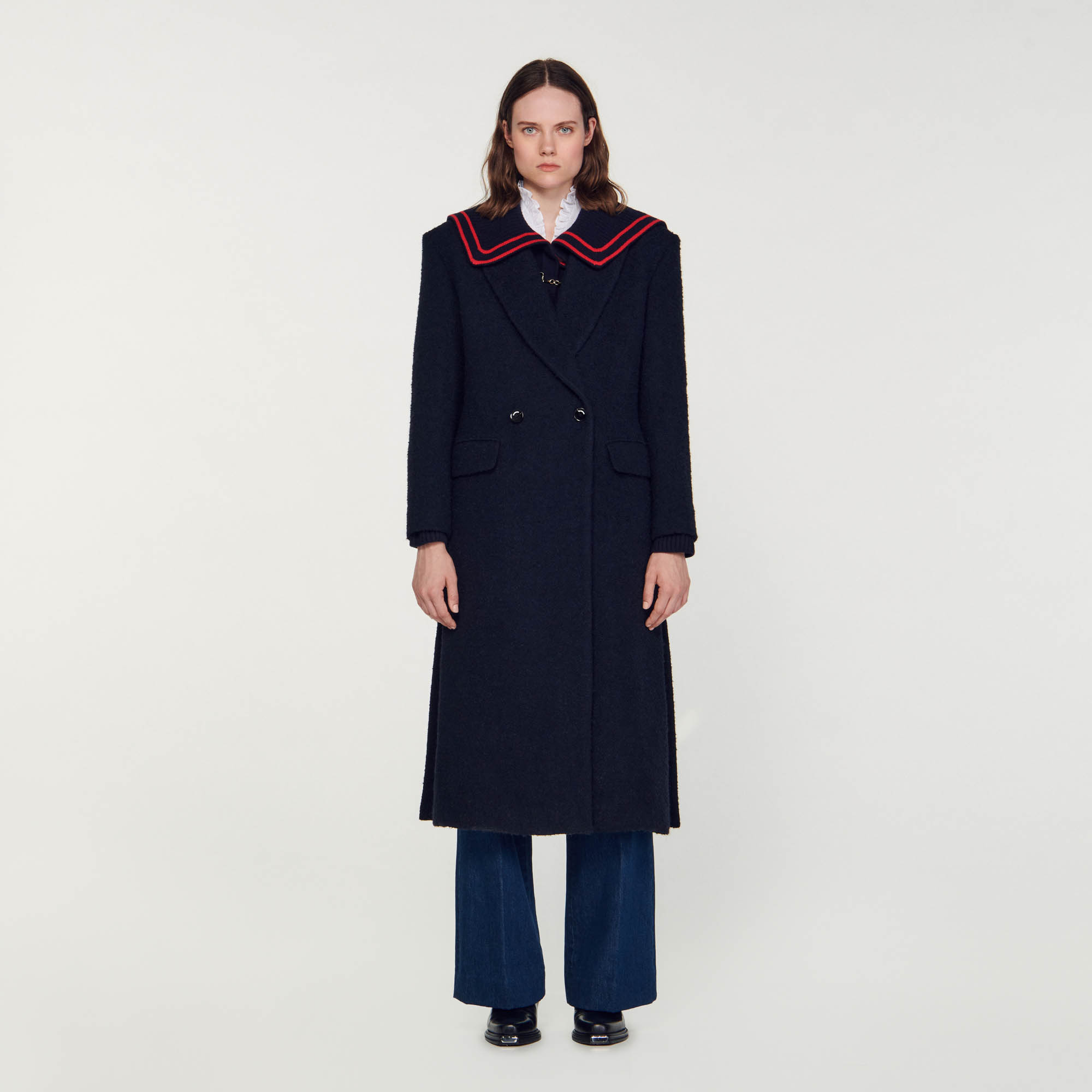 Sandro cotton Long coat in wool bouclé fabric, featuring a lapel collar, long sleeves, a double-breasted design and flap pockets
