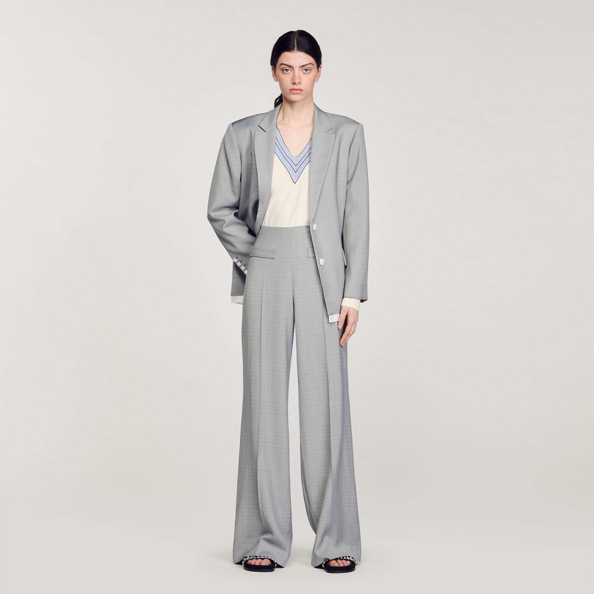 Sandro viscose Belt lining: High-waisted trousers with flared legs and ironed creases, featuring large welt pockets