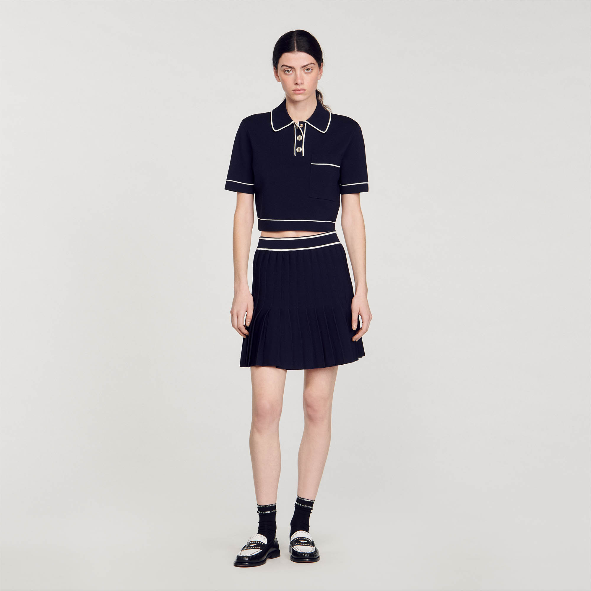 Sandro viscose Cropped short-sleeved knit sweater with press-stud polo collar, patch pocket on chest and embellished with contrast piping