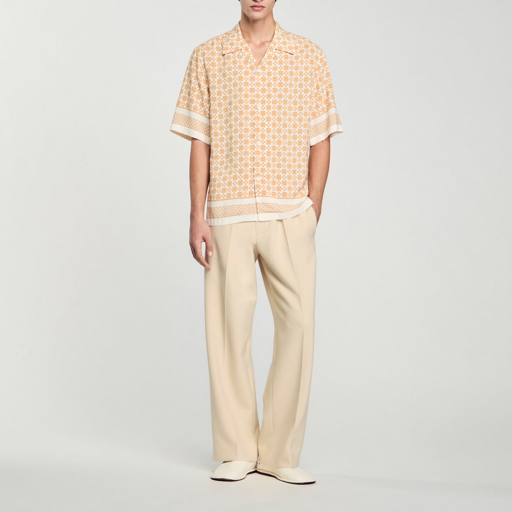 Sandro viscose Flowing shirt with a square cross motif, featuring a shark collar, short sleeves and button fastening
