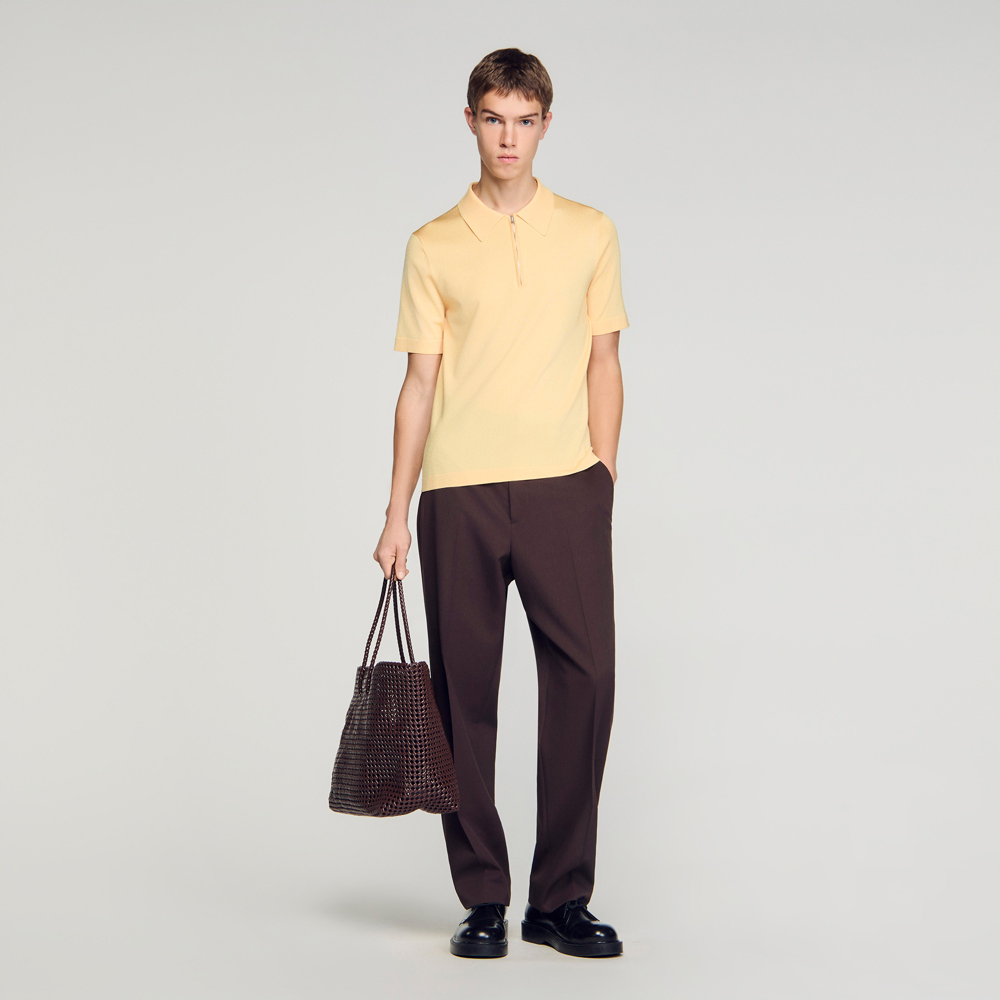 Knitted polo shirt with zip collar in Black for Men | Sandro Paris