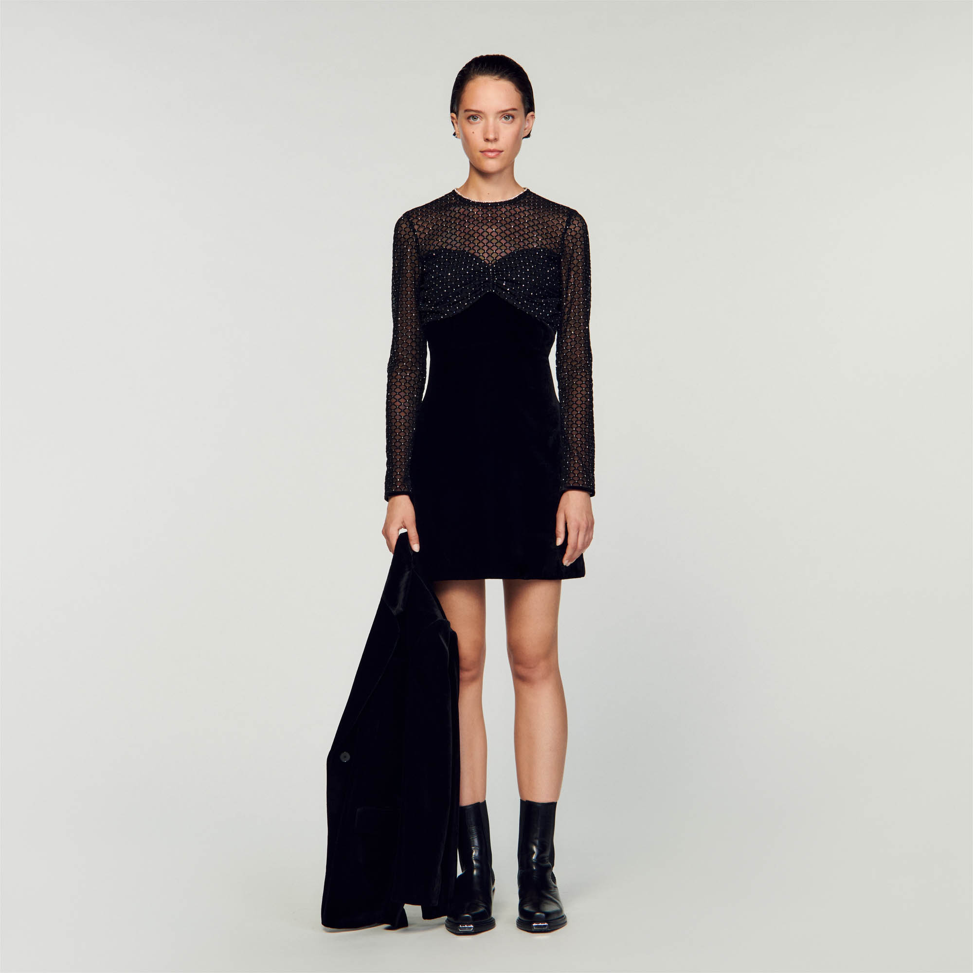 Sandro viscose Dual-material short dress in plain velvet and tulle covered in rhinestones, with a round neck embellished with rhinestones, long sleeves and a gathered panel under the bust