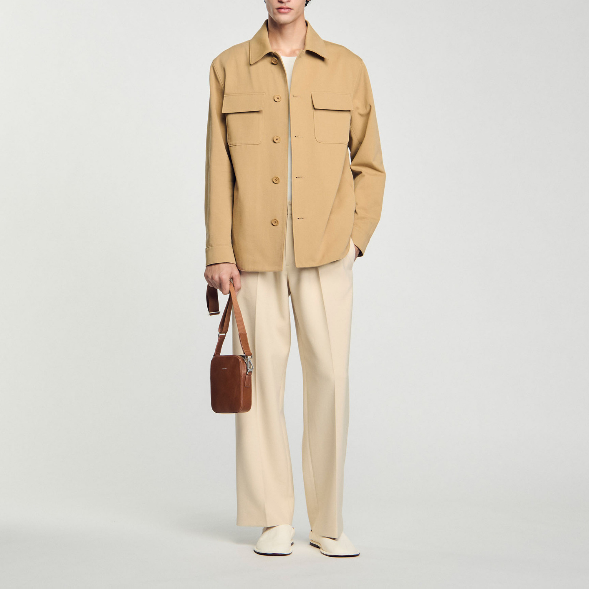 Sandro cotton Long-sleeved oversized shirt with button placket, classic collar and patch pockets with flaps Sandro Men's oversized shirt Casual fit Classic collar Long sleeves with button cuffs 2 patch pockets with flaps Designed for an oversized fit