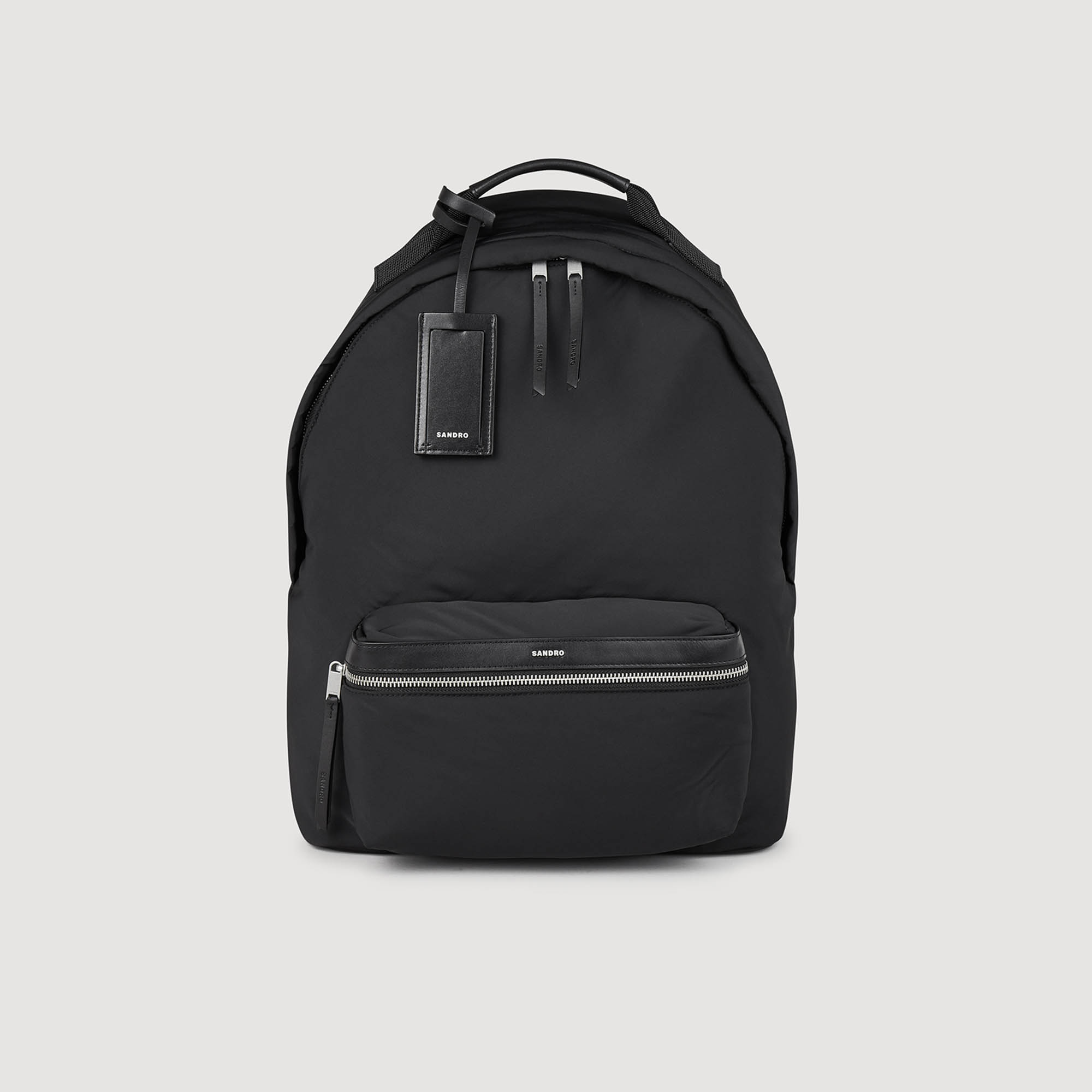 Sandro polyester Lining: Canvas backpack with leather details, featuring a zip fastening with Sandro embossed pull tab, front zip pocket, label holder, internal storage pocket, and adjustable padded straps