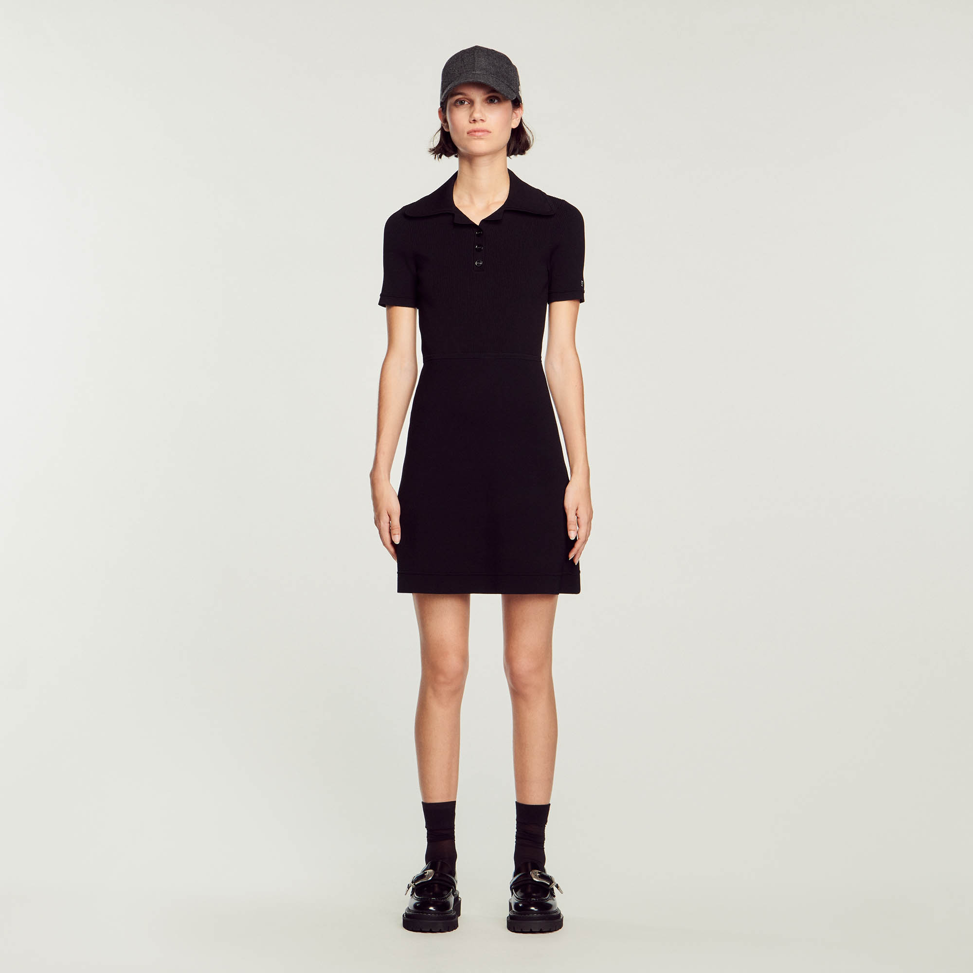 Sandro viscose Ribbed knit midi dress with a 3-button polo neck, short sleeves, and a flared skirt