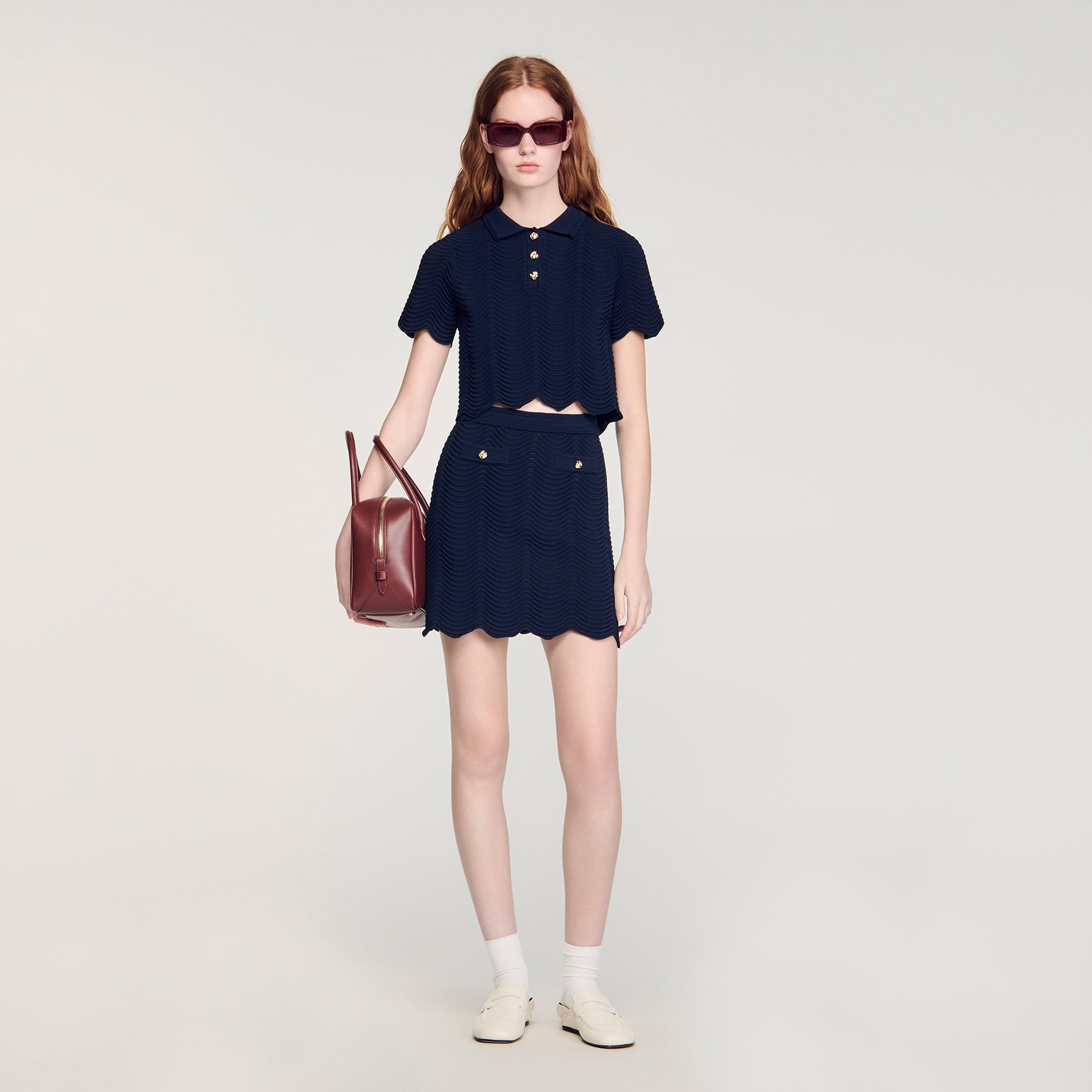 Sandro viscose Mini flared skirt in decorative stitch knit, featuring a decorative button on the high waist