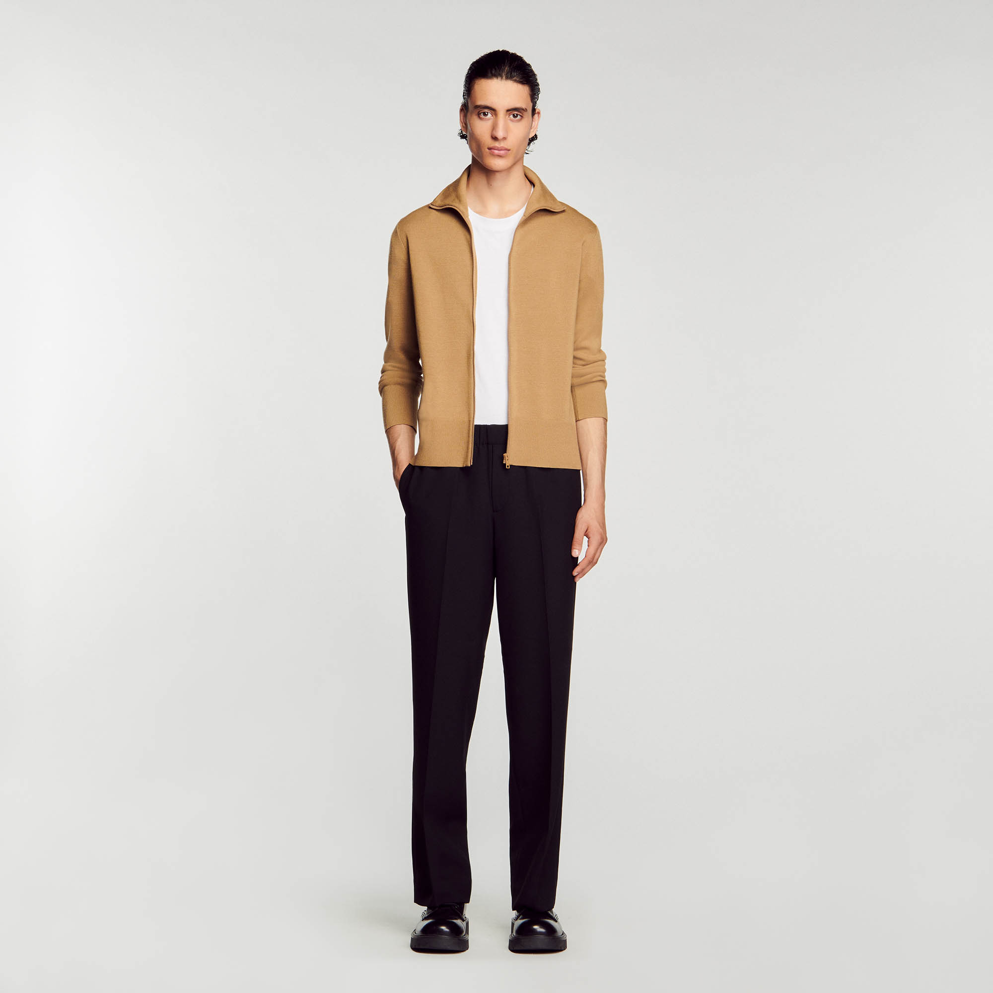 Sandro wool Sandro men's cardigan â€¢ Wool cardigan â€¢ High neck â€¢ Zip fastening on the front â€¢ Long sleeves â€¢ Ribbed trim finish The wool in this item comes from extensive farming, which respects animal welfare and contributes to the preservation of local biodiversity