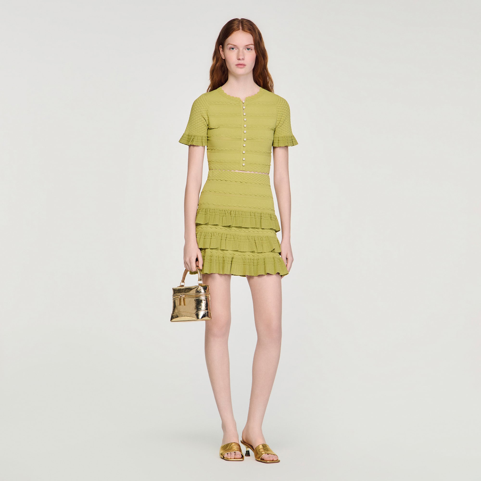 Sandro viscose Cropped decorative knit top with a round neckline, featuring short ruffled sleeves, a button fastening on the upper front and decorative buttons on the body