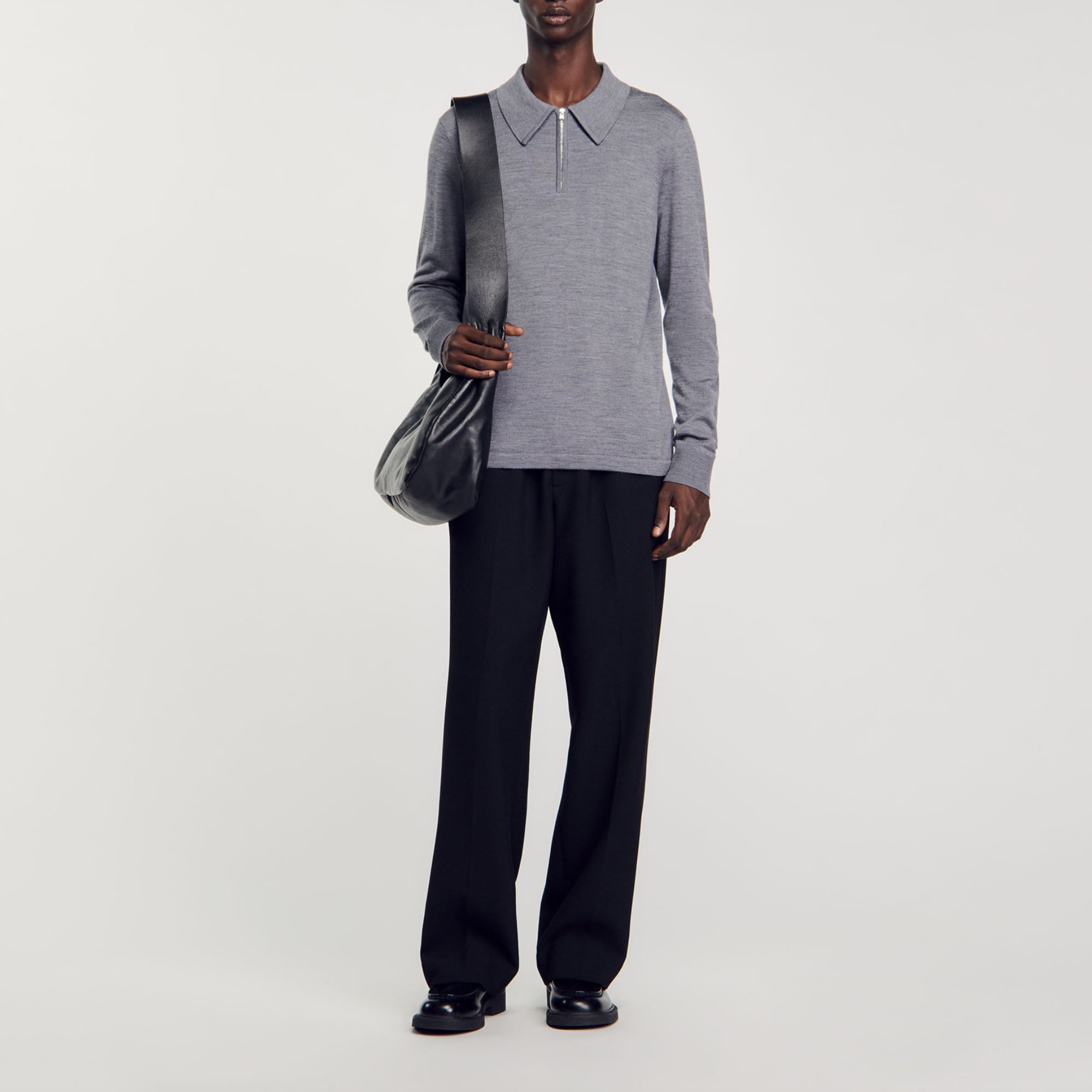 Sandro wool Knit sweater with a zip-up polo collar and long sleeves; Sandro Men's knit sweater Polo collar with zip Long sleeves The wool in this item comes from extensive farming, which respects animal welfare and contributes to the preservation of local biodiversity