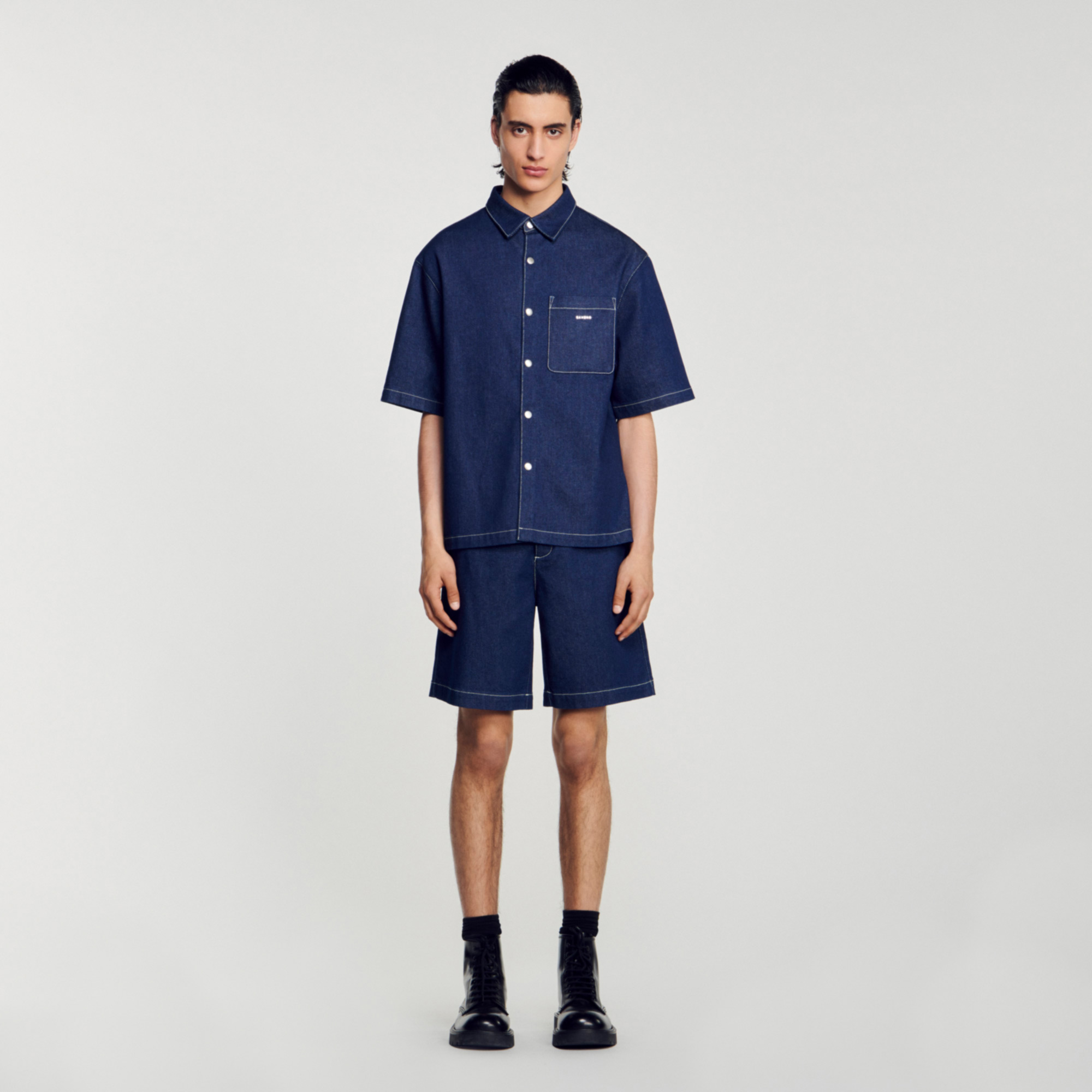 Sandro cotton Untreated denim shirt with a classic collar, short sleeves, a button fastening, and a pocket on the chest