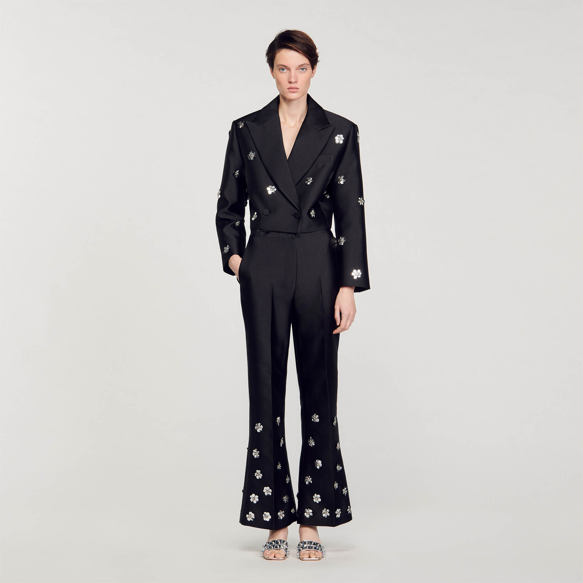 Sandro polyester Lining: Flared satin-effect trousers embellished with embroidered metallic flowers on the hem