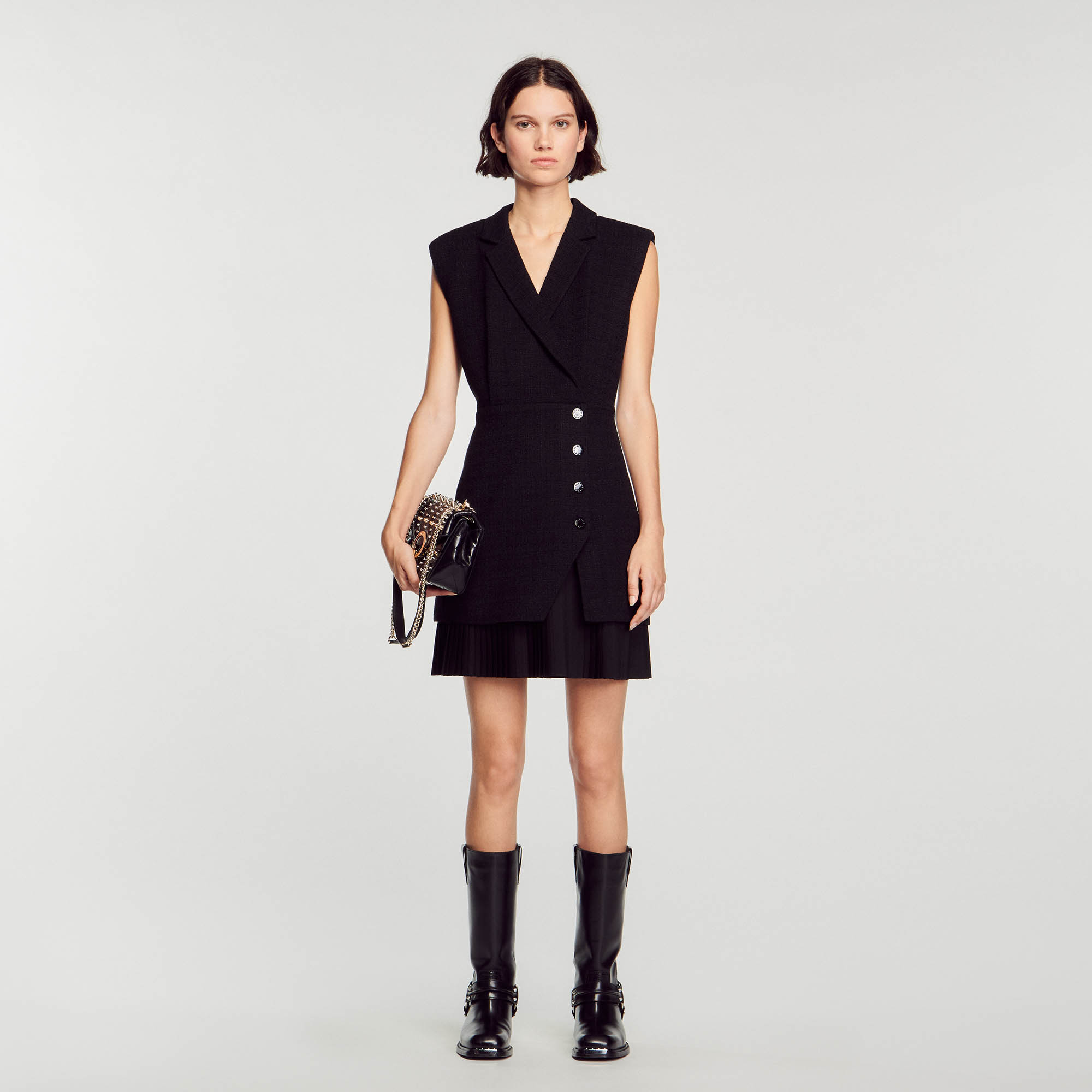 Sandro cotton Straight-cut sleeveless wrap dress in tweed with a jacket-style neckline, and a pleated layered skirt decorated with snap fasteners
