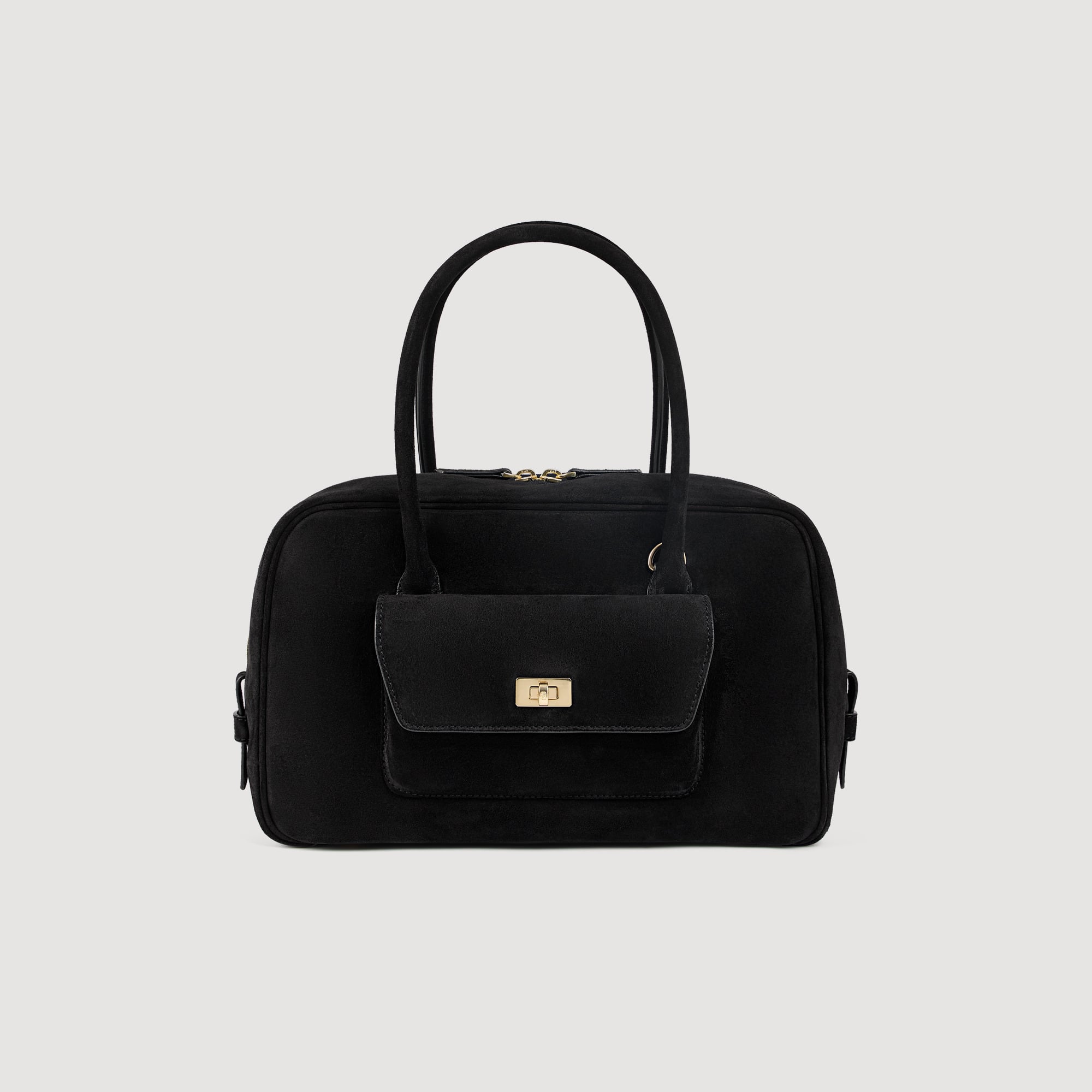 Sandro leather Suede bag with a zip fastening on top, featuring a removable and adjustable shoulder strap for carrying by hand or across the body