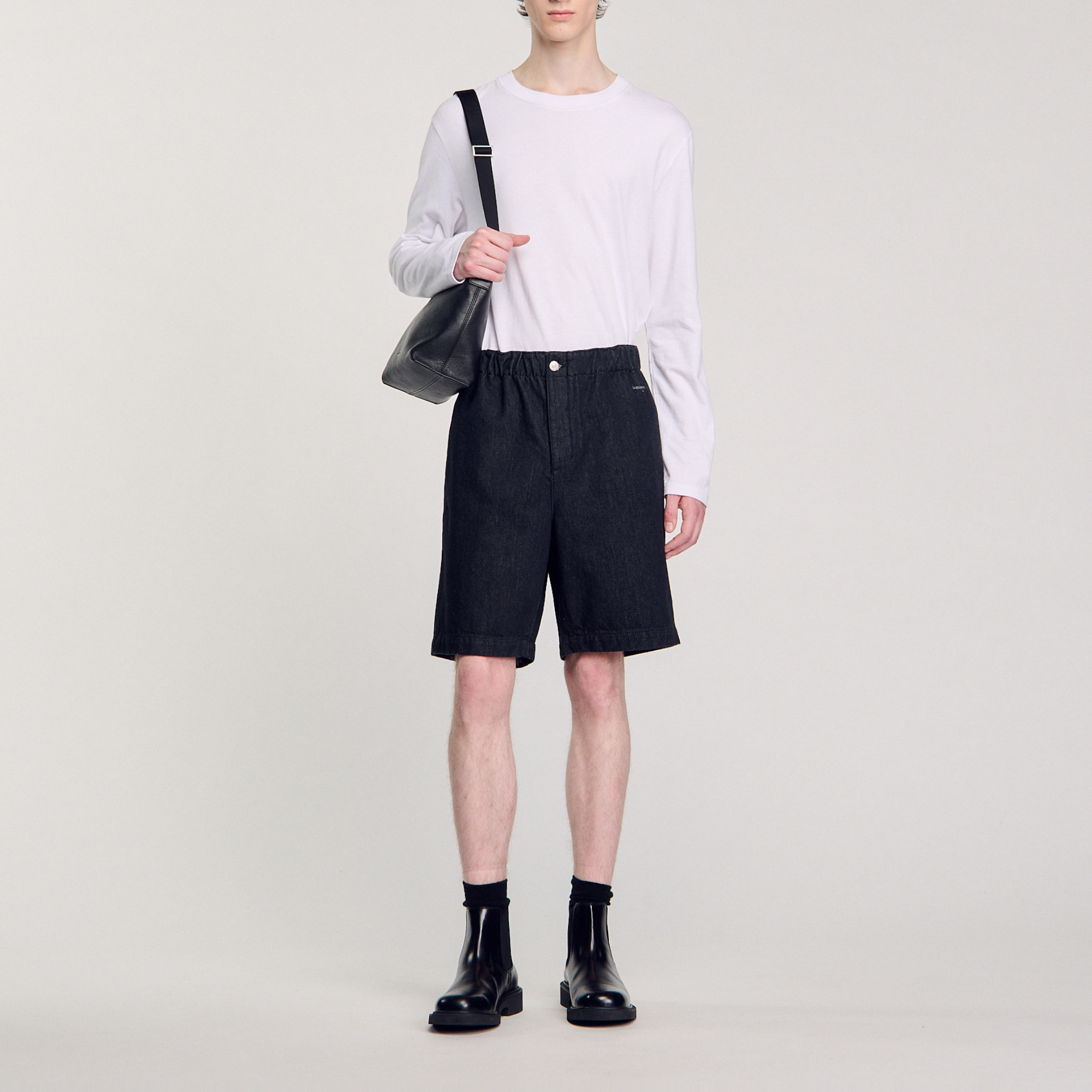 Sandro cotton Raw denim Bermuda shorts with elasticated waistband, button fastening, two XL patch pockets on the back and metal Sandro logo