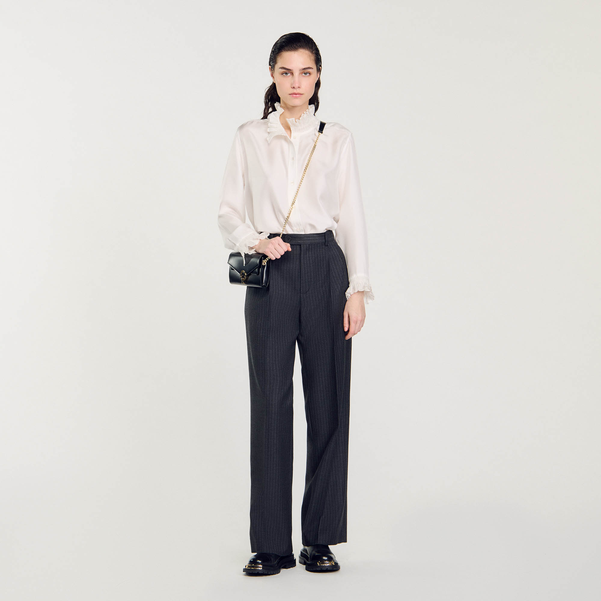 Sandro wool Lining: Straight-leg, oversize wool pants with ironed creases, embellished with fine stripes, side pockets and welt pockets on the back