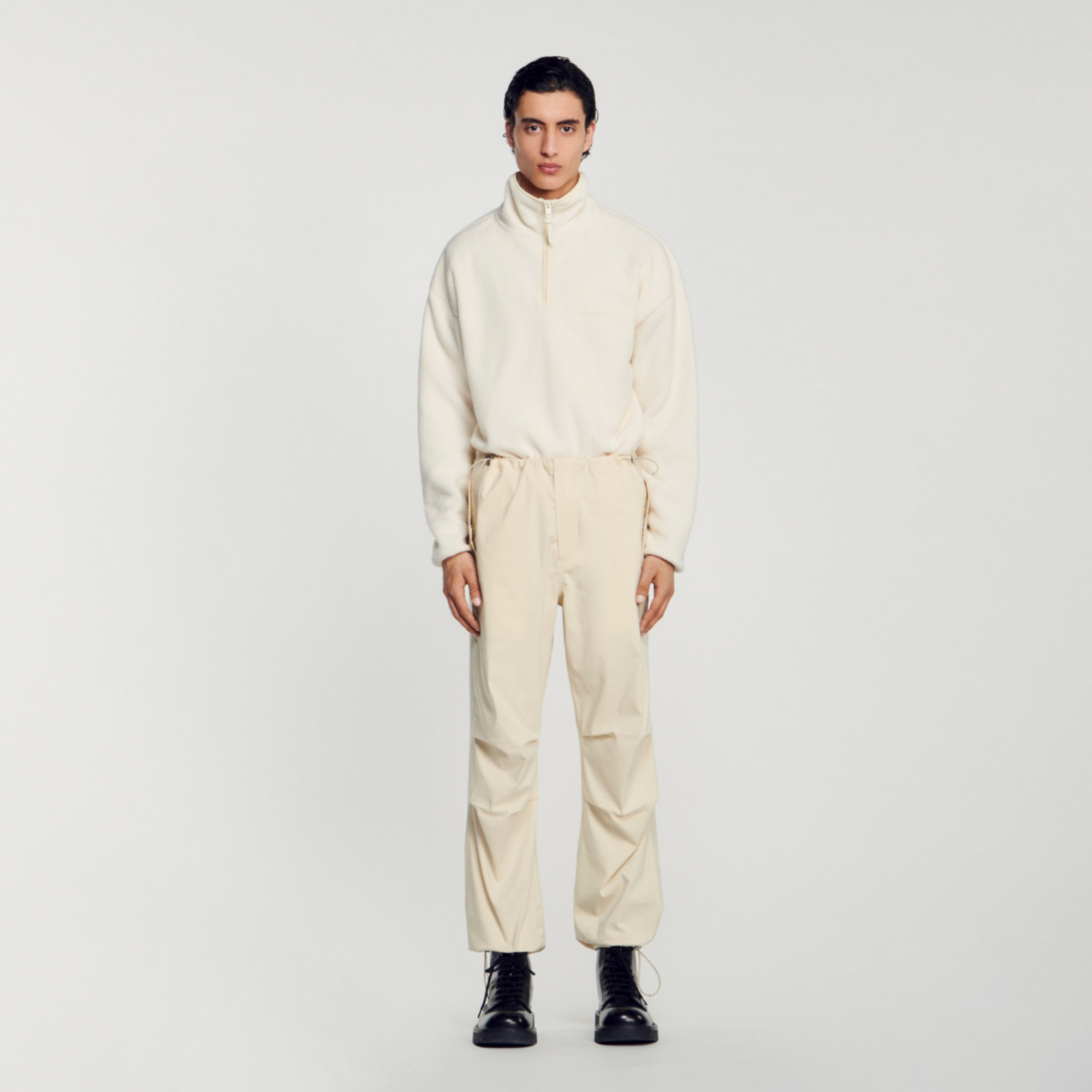 Sandro cotton Parachute pants with a baggy fit, side pockets, and elastics with cord locks at the waist and ankles