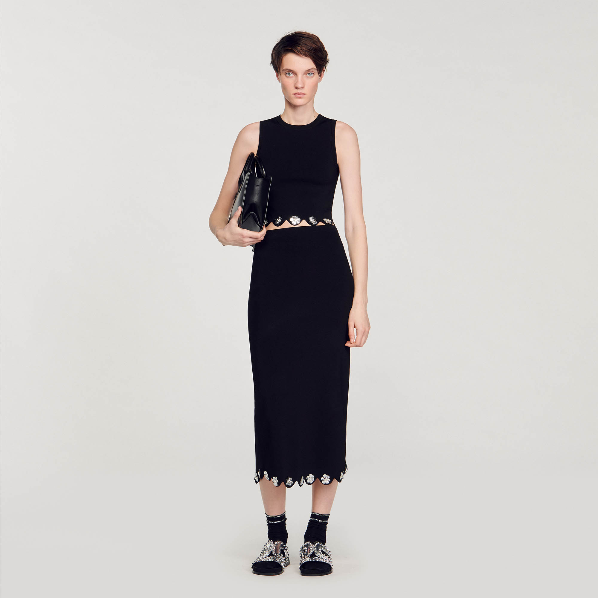 Sandro viscose Long knit skirt with a high waist, and a scalloped hemline embellished with sequinned flowers at the bottom