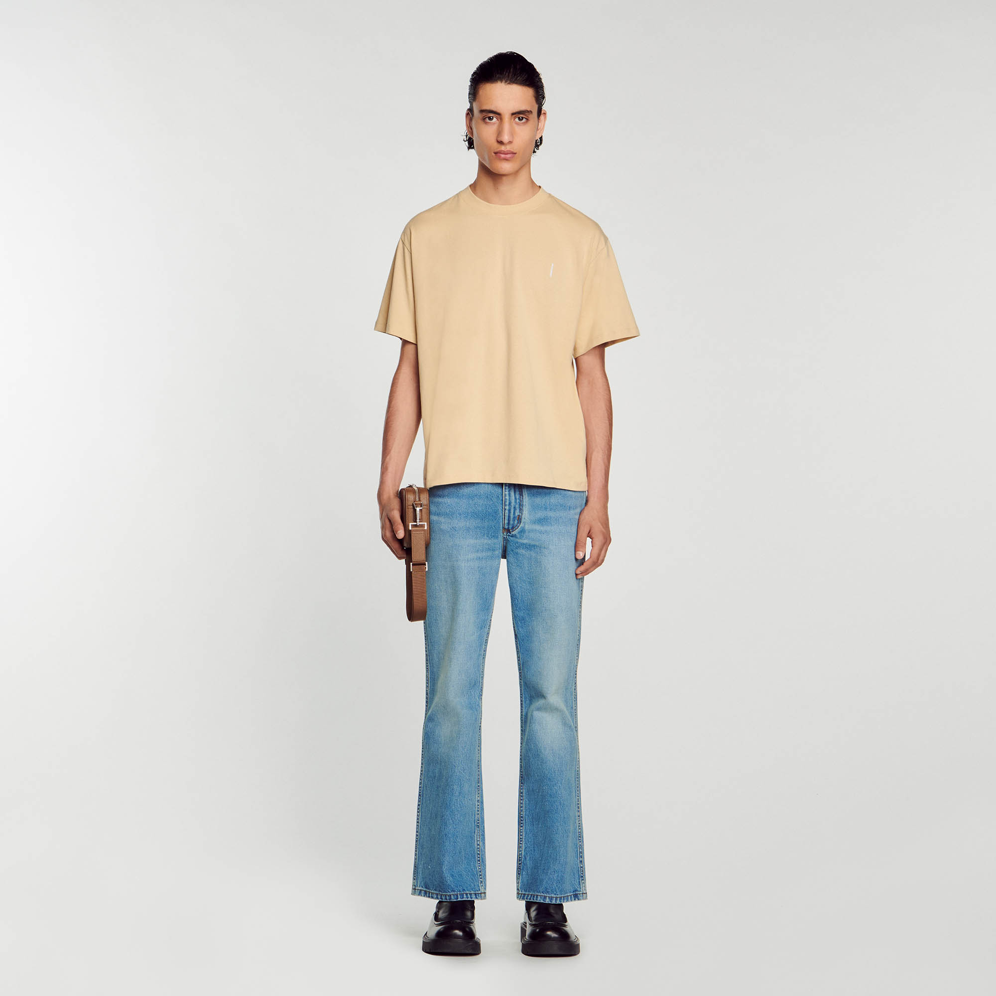 Sandro cotton Embroidery: Oversized cotton T-shirt with a round neck, short sleeves, and vertical Sandro embroidery